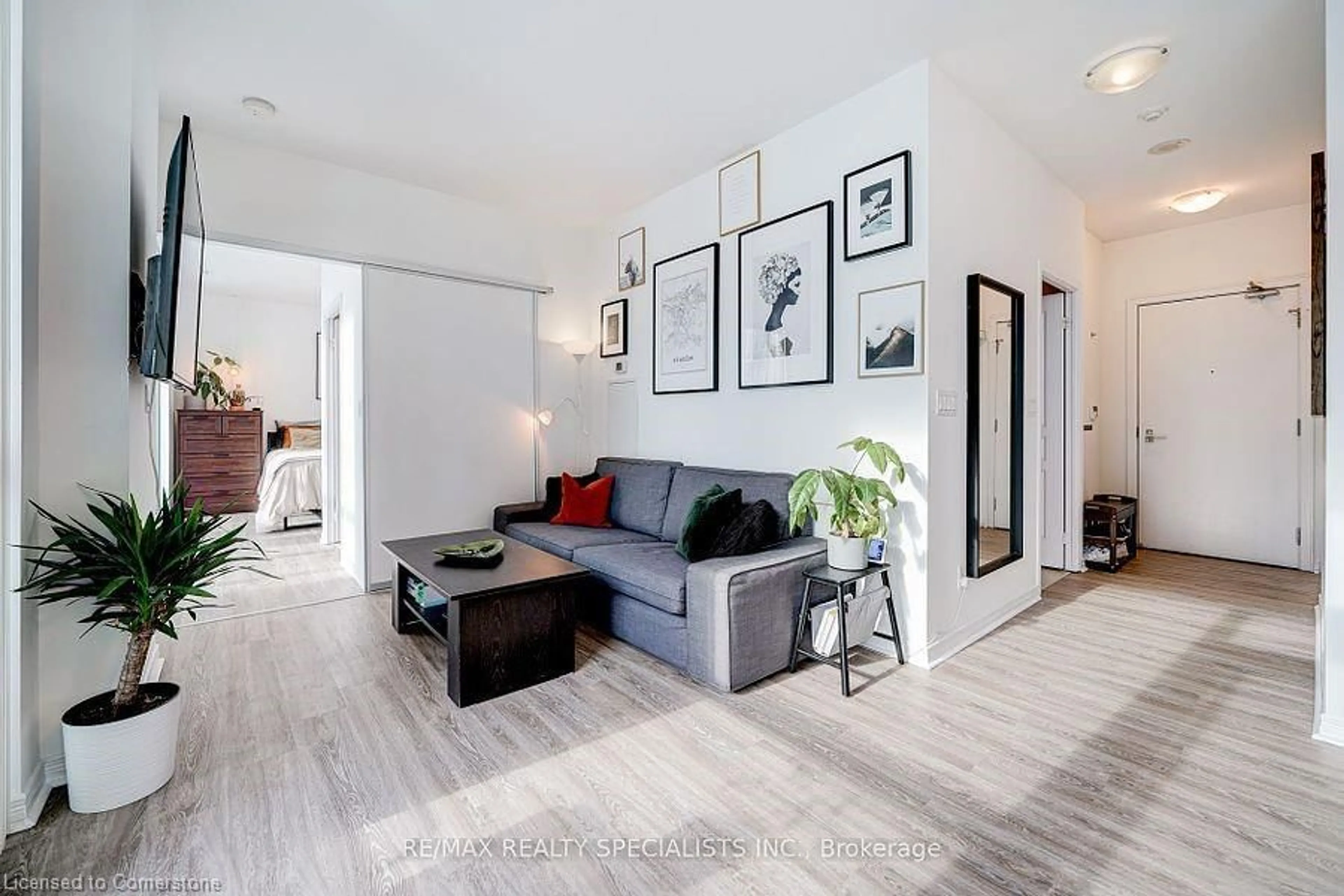 Living room with furniture, wood/laminate floor for 352 Front St #2305, Toronto Ontario M5V 0K3