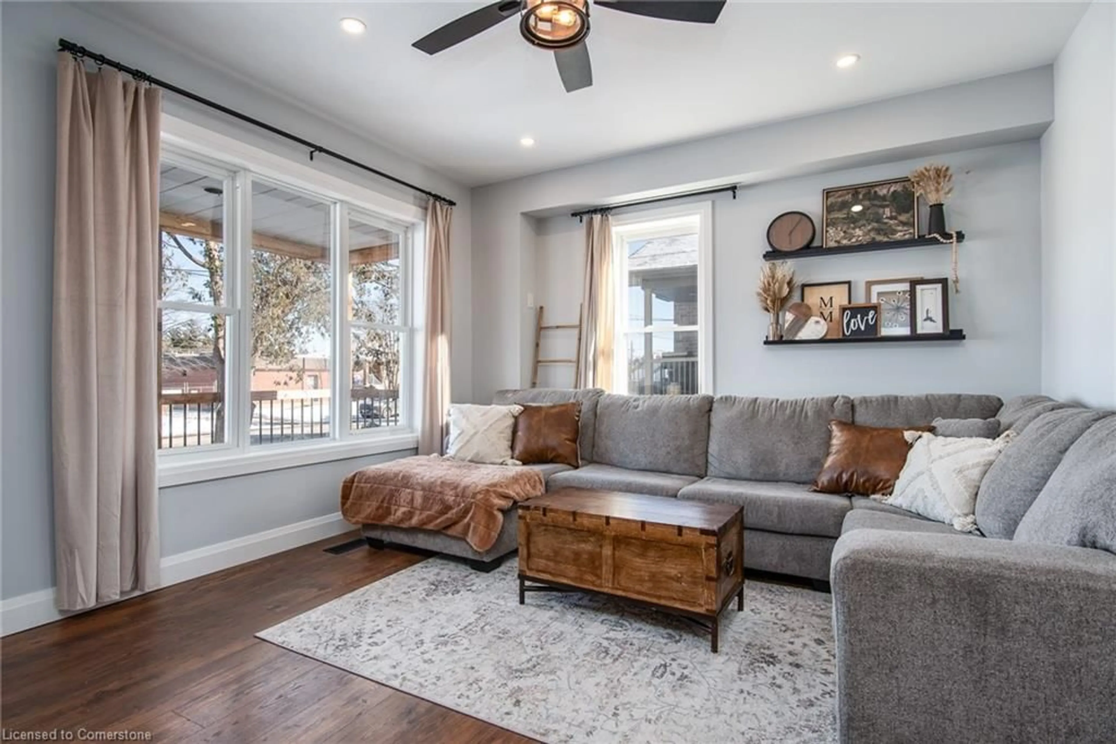 Living room with furniture, wood/laminate floor for 54 Mill St, Baden Ontario N3A 2N6