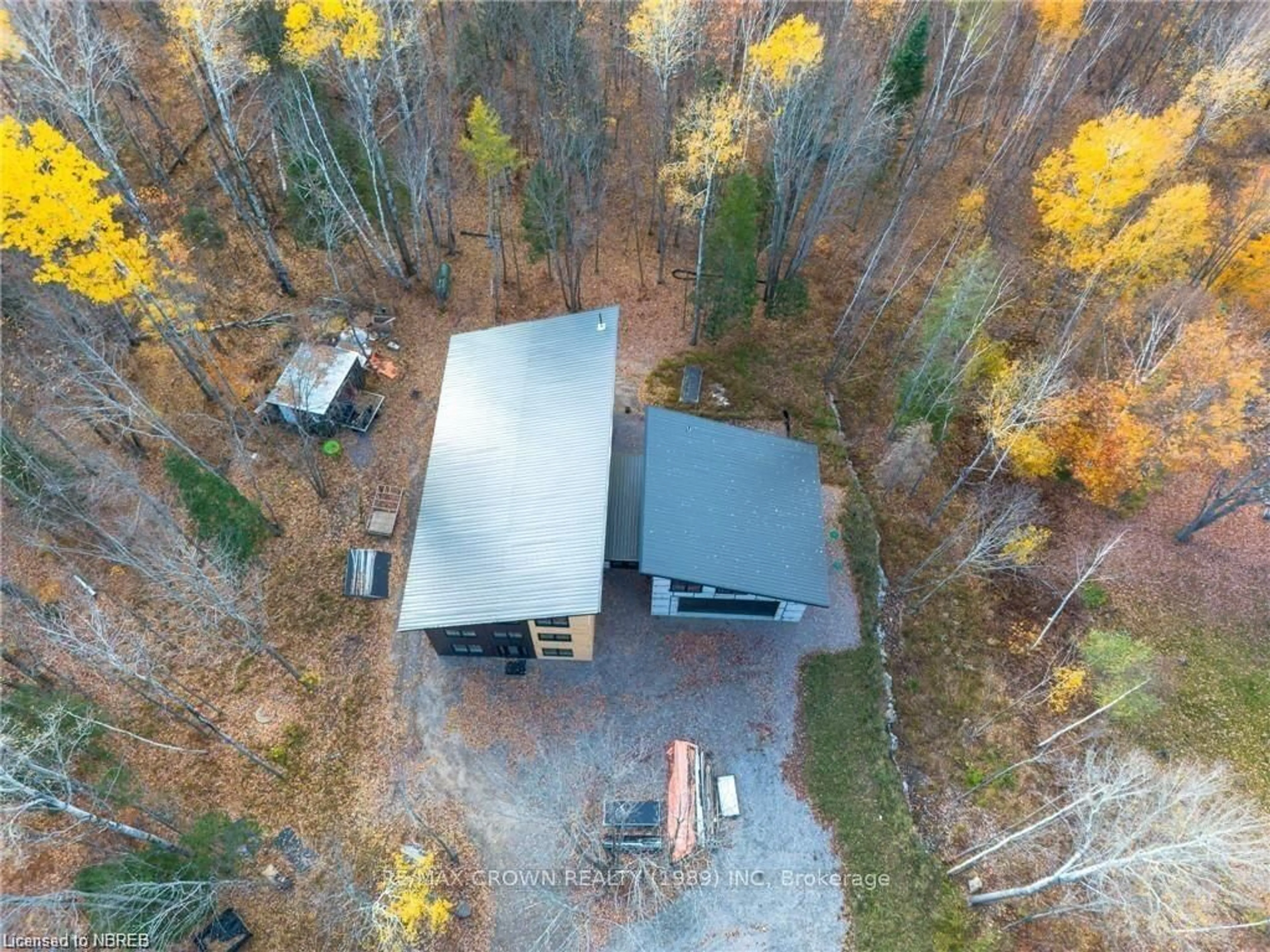 A pic from outside/outdoor area/front of a property/back of a property/a pic from drone, forest/trees view for 24 Sun Valley Way, Powassan Ontario P0H 1Z0