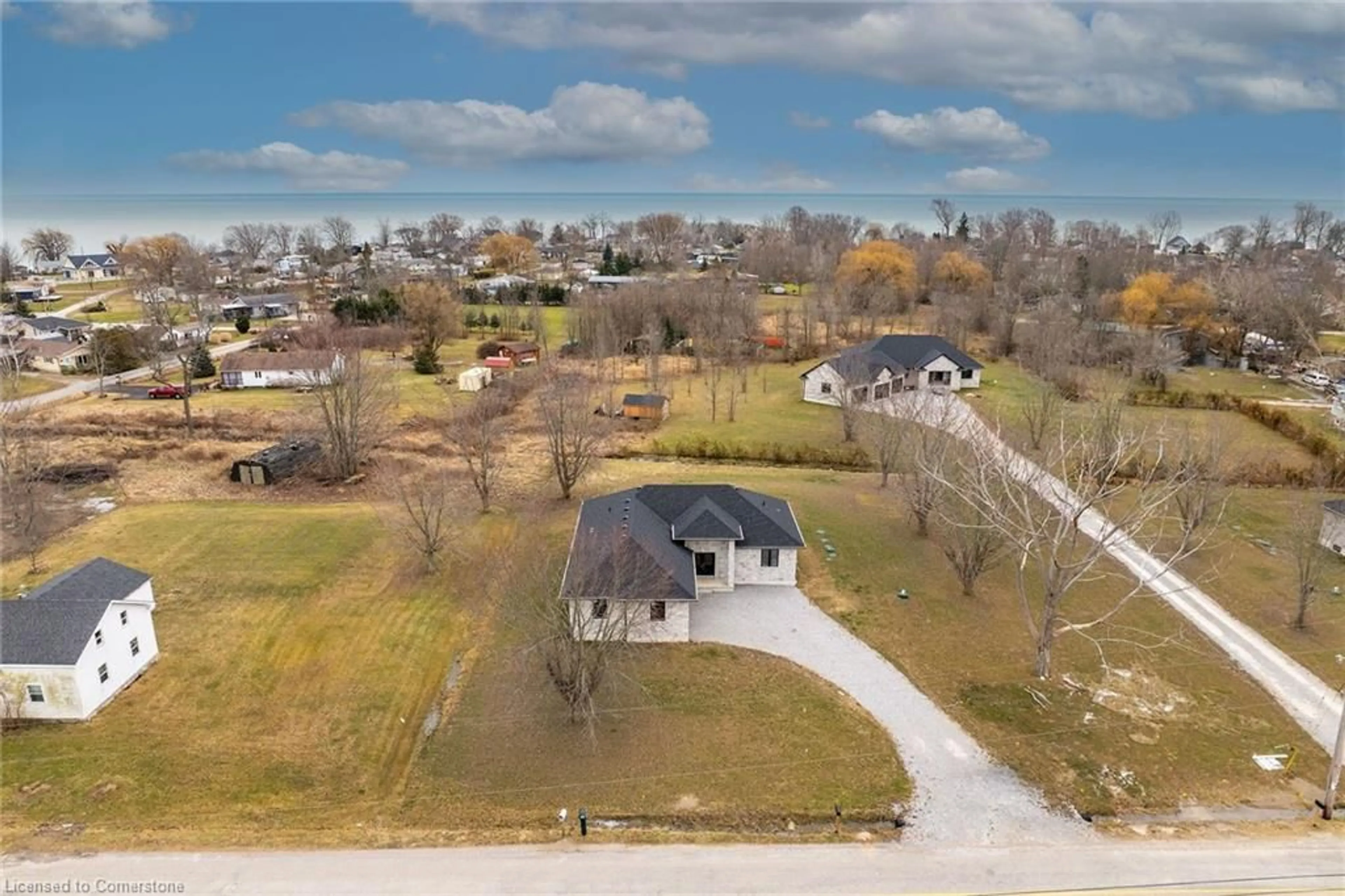 A pic from outside/outdoor area/front of a property/back of a property/a pic from drone, street for 794 South Coast Dr, Peacock Point Ontario N0A 1P0