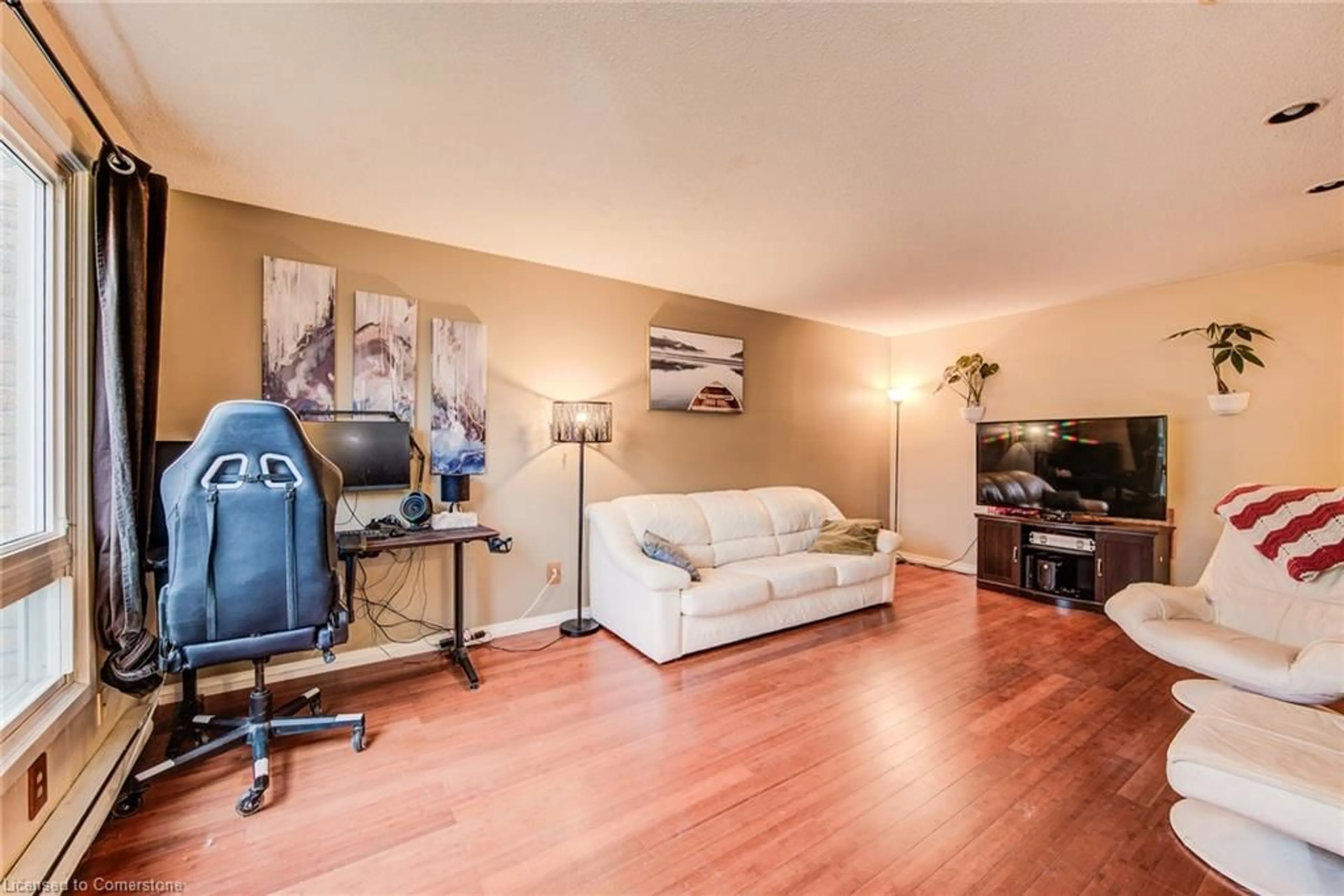 Living room with furniture, wood/laminate floor for 249 Cedarbrae Ave #16, Waterloo Ontario N2L 4S8