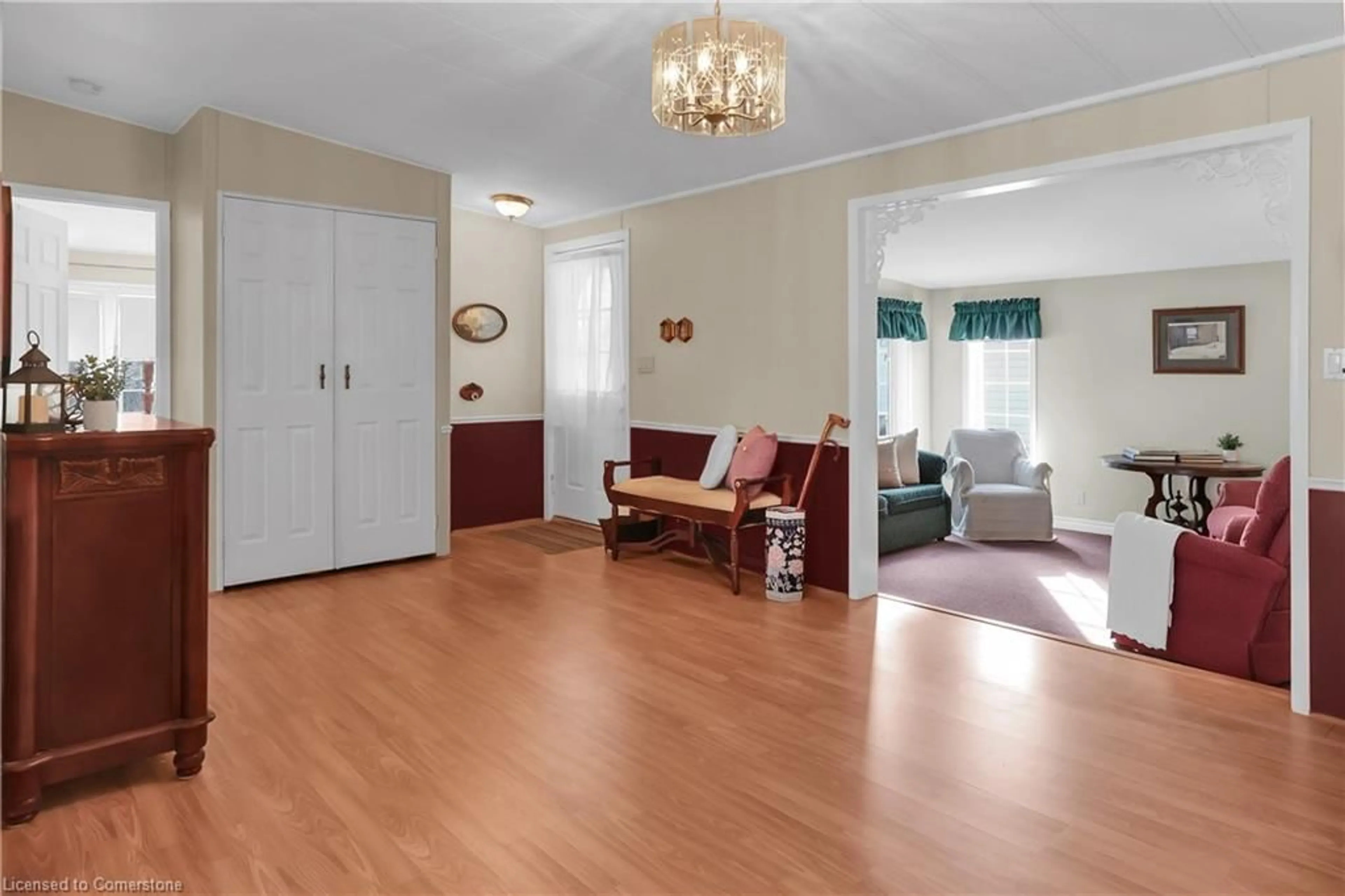 Living room with furniture, wood/laminate floor for 3033 Townline Rd #353, Stevensville Ontario L0S 1S1