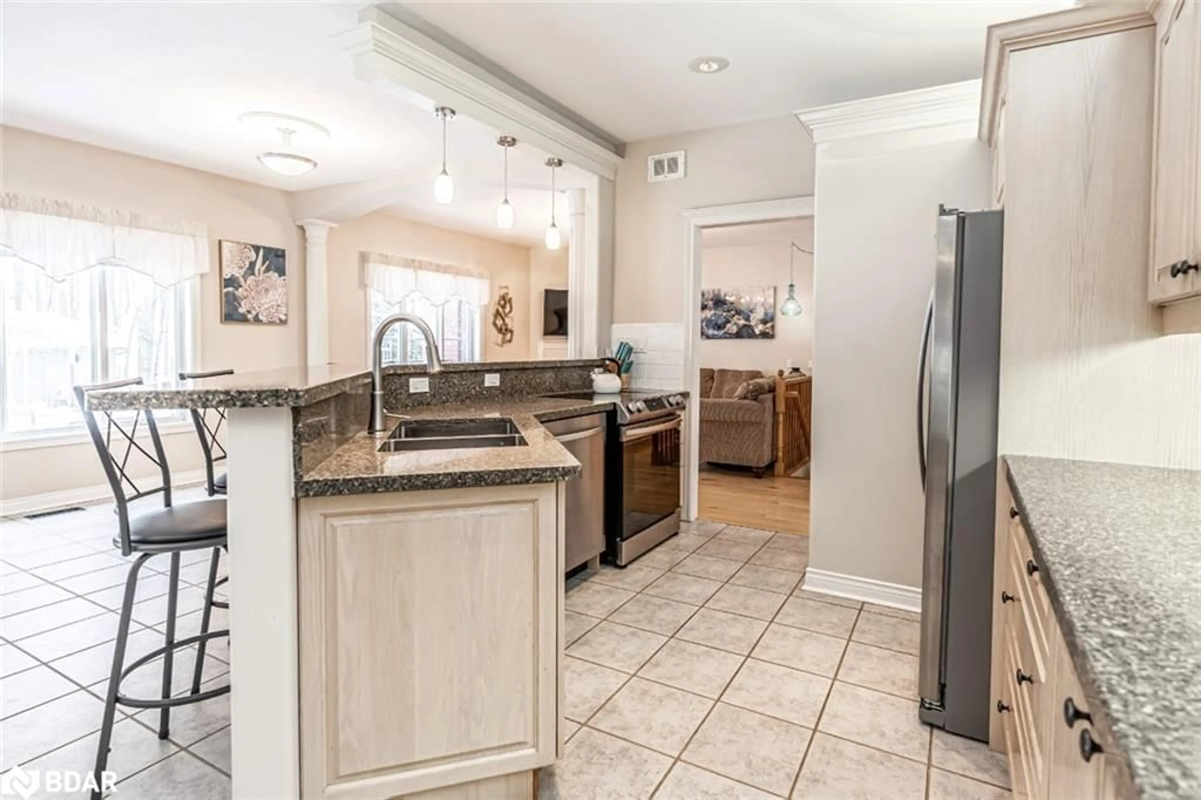 Open concept kitchen, ceramic/tile floor for 128 Wildwood Trail, Barrie Ontario L4N 7Z6