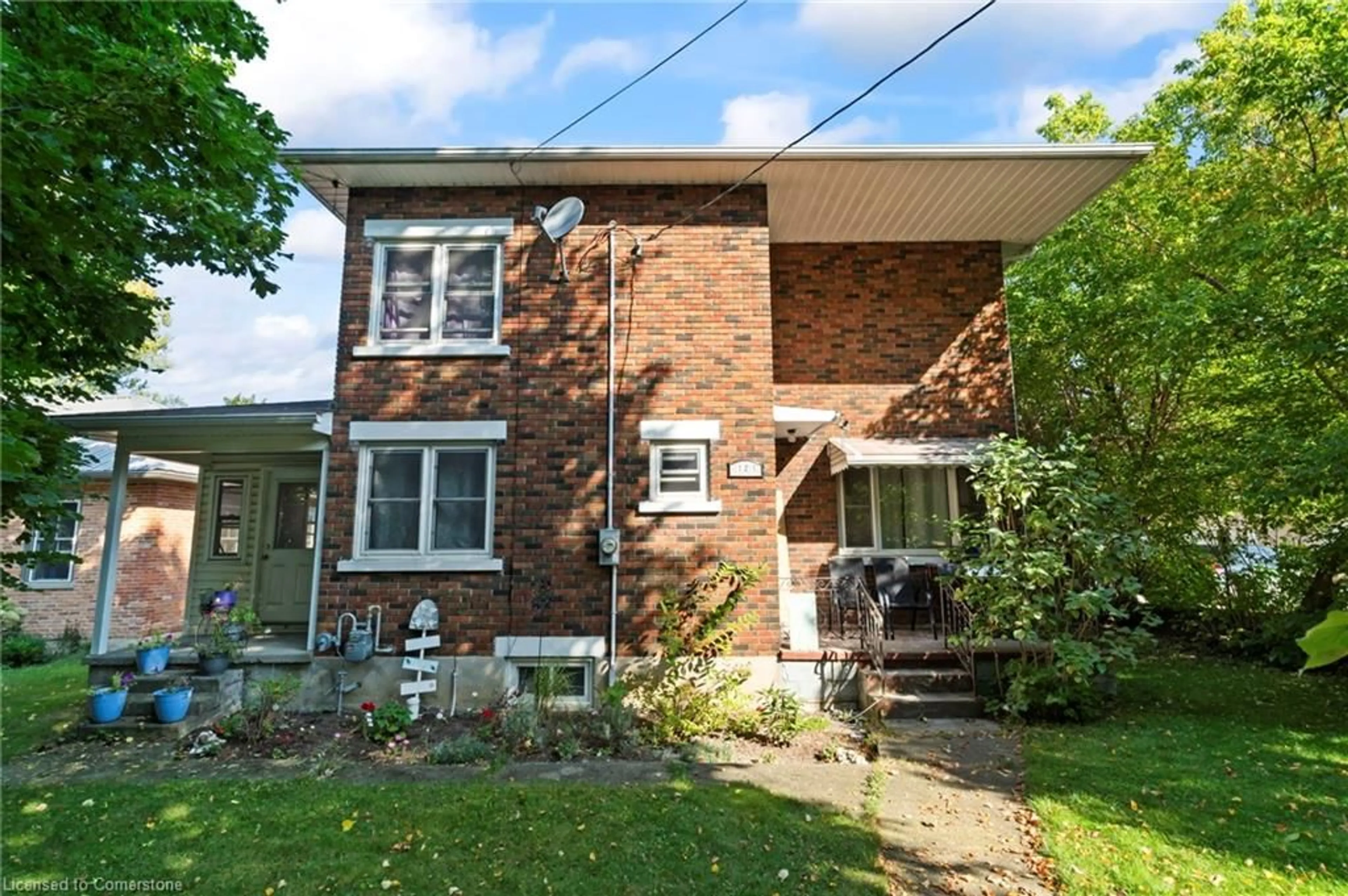 Home with brick exterior material, street for 121 Queen St, Mount Forest Ontario N0G 2L3