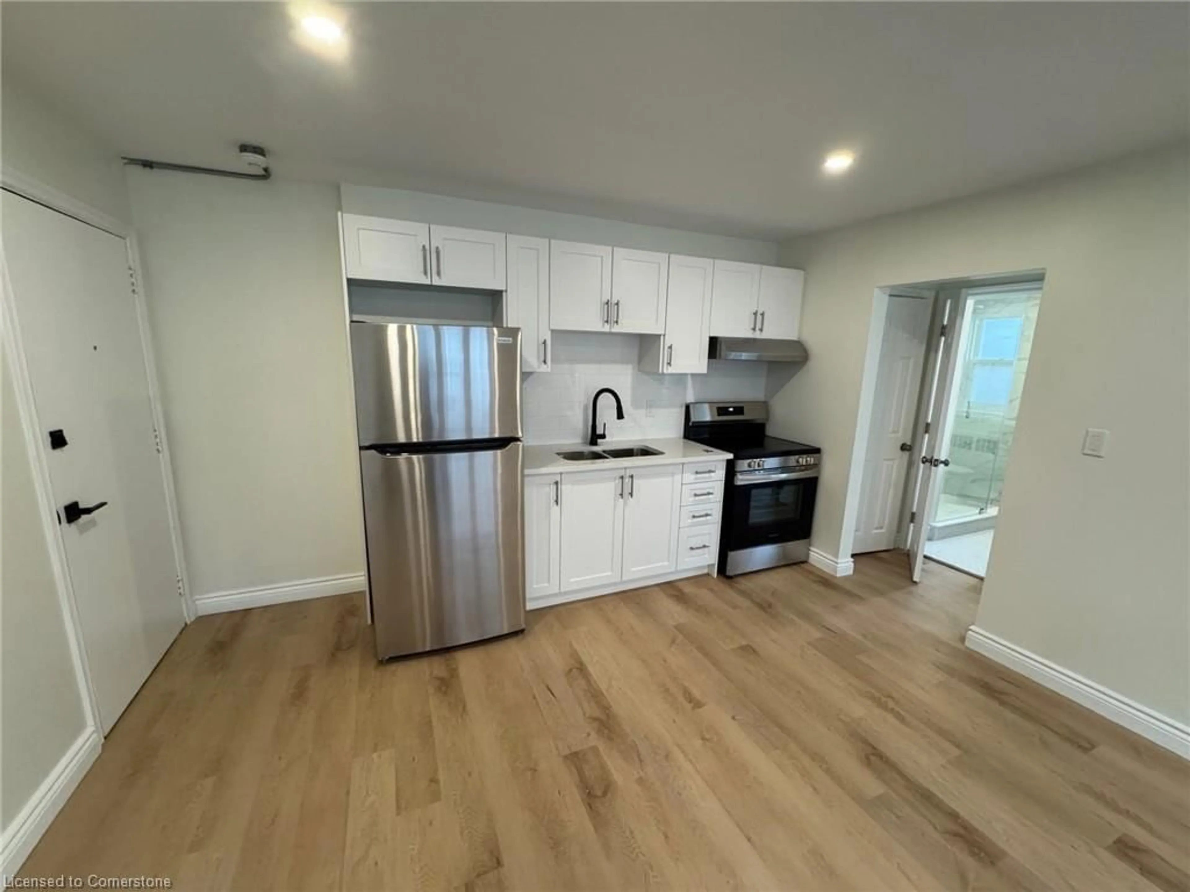 Open concept kitchen, wood/laminate floor for 1759 King St #15, Hamilton Ontario L8K 1V6