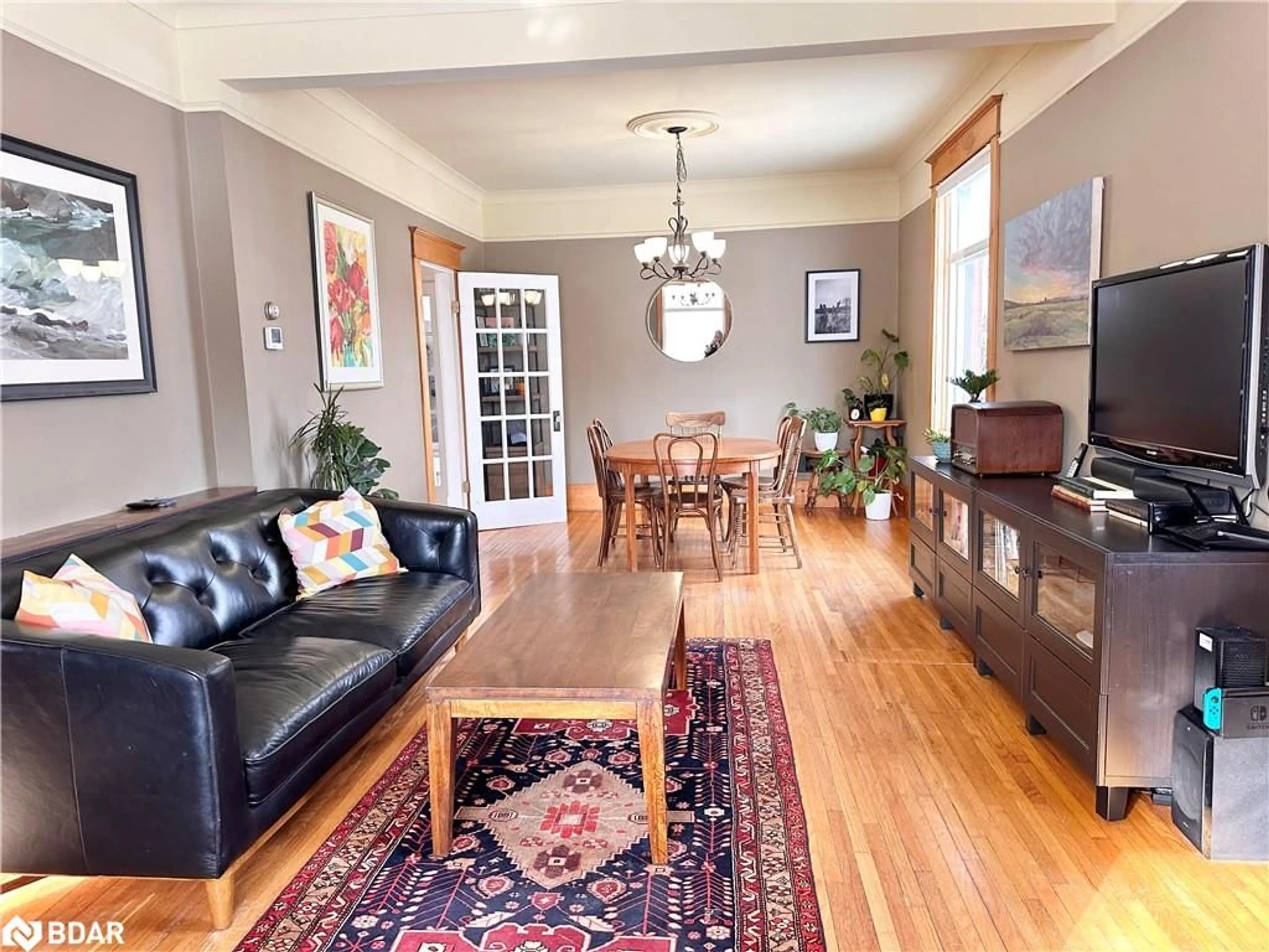 Living room with furniture, wood/laminate floor for 12 Elizabeth St, Creemore Ontario L0M 1G0