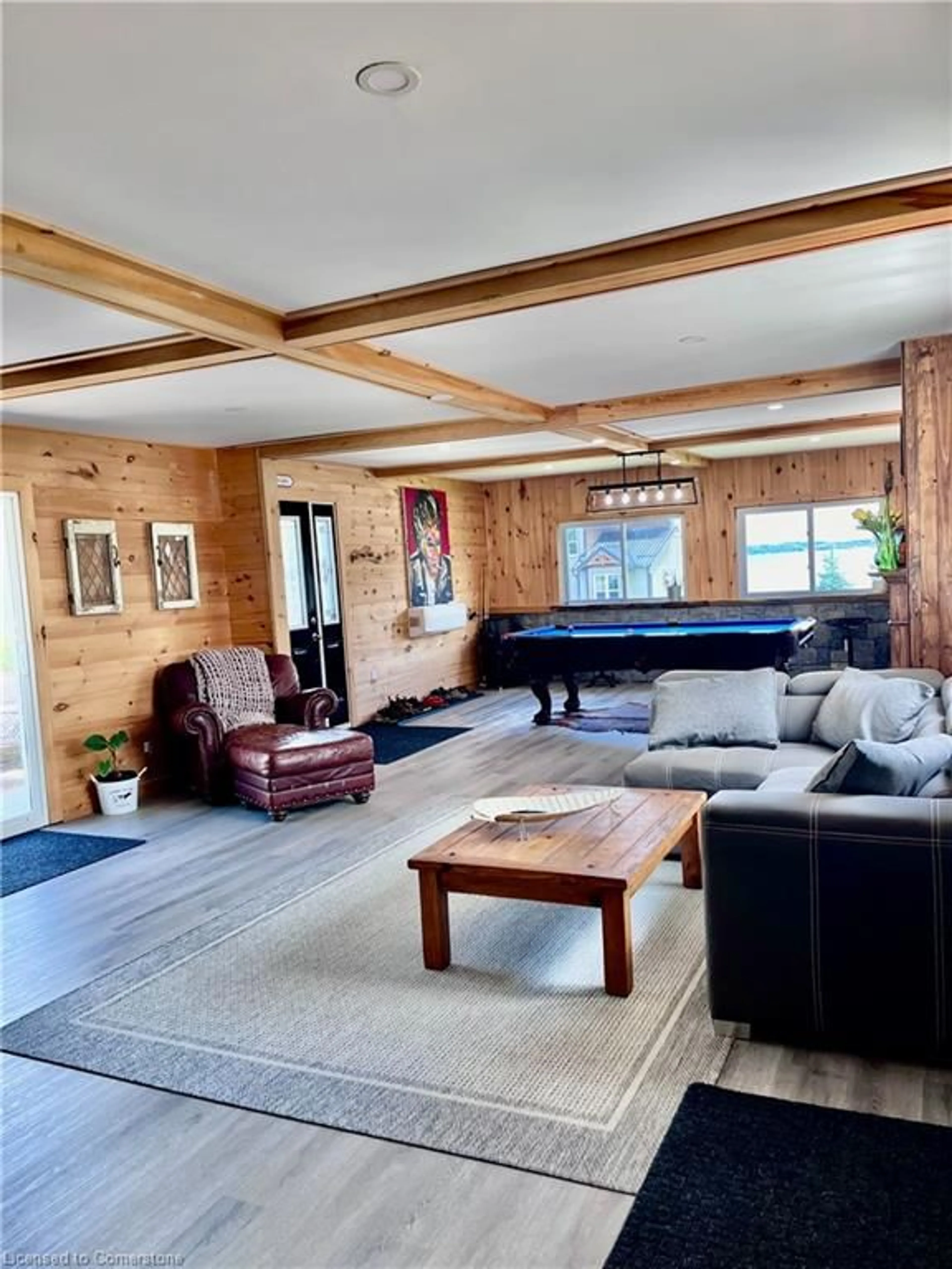 Living room with furniture, wood/laminate floor for 31 Blue Bay Lane, Fenelon Falls Ontario K0M 1N0