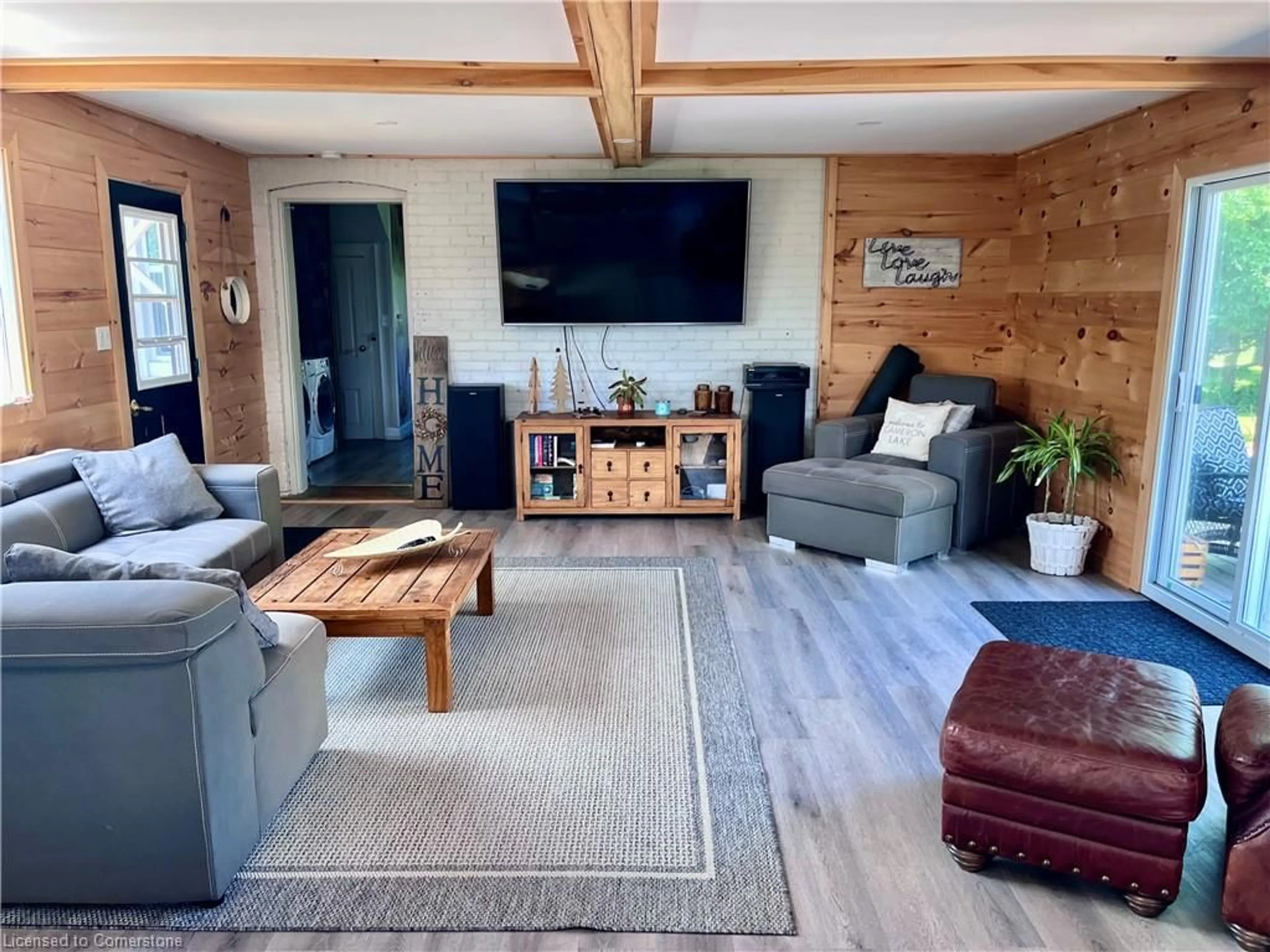 Living room with furniture, wood/laminate floor for 31 Blue Bay Lane, Fenelon Falls Ontario K0M 1N0