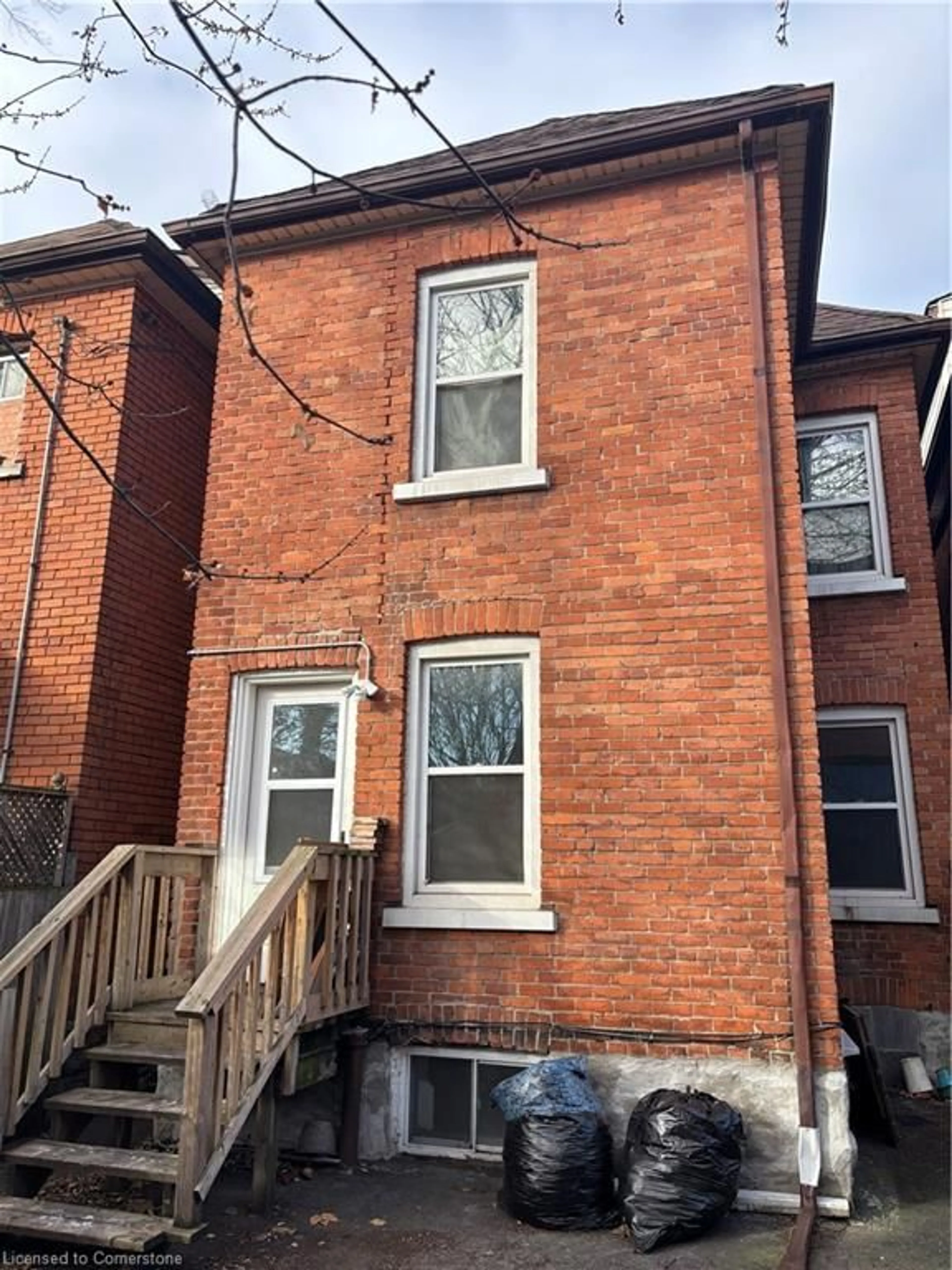 Home with brick exterior material, street for 66 Stirton St, Hamilton Ontario L8L 6E9