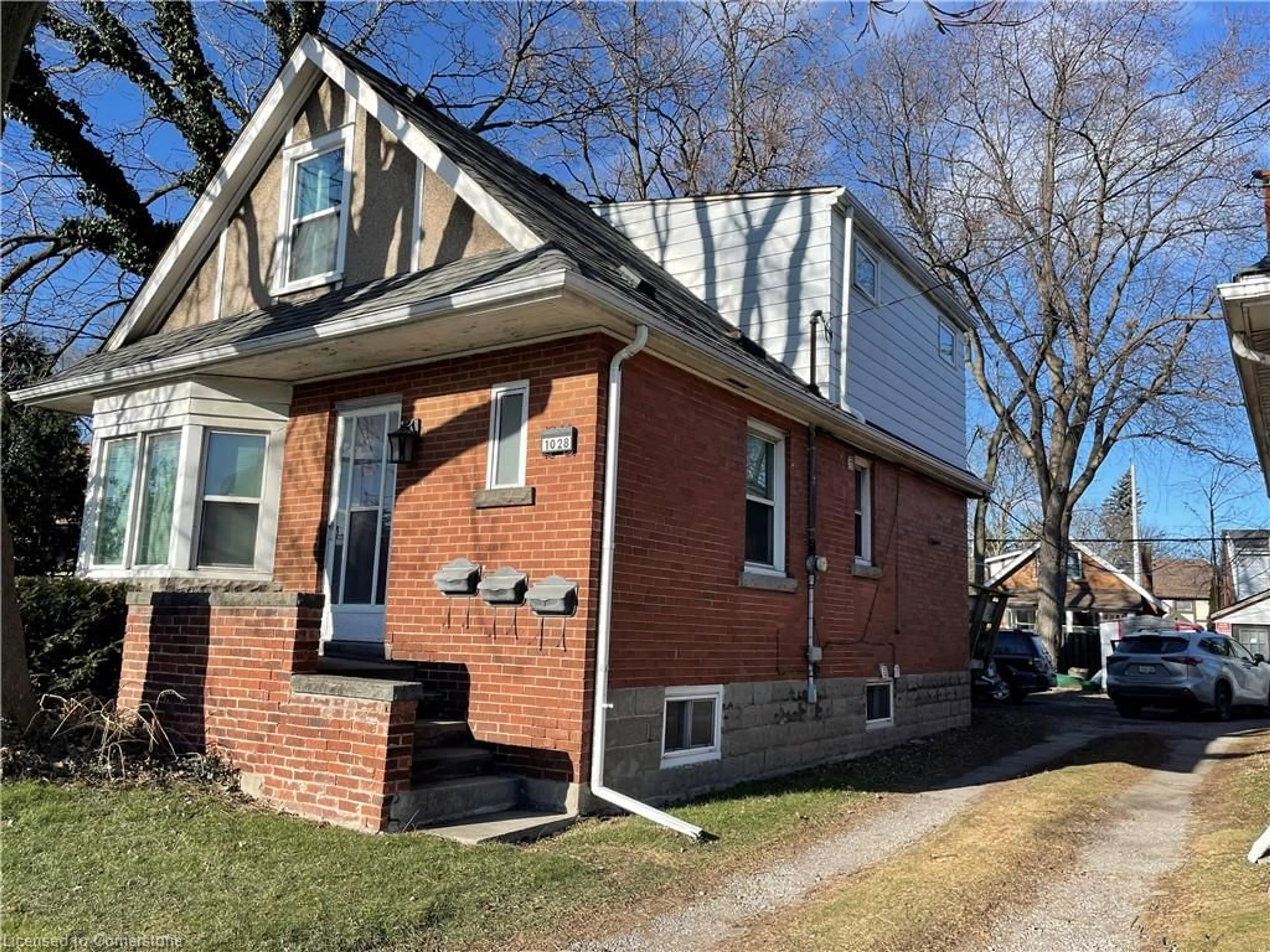 Home with brick exterior material, street for 1028 Main St, Hamilton Ontario L8S 1B2