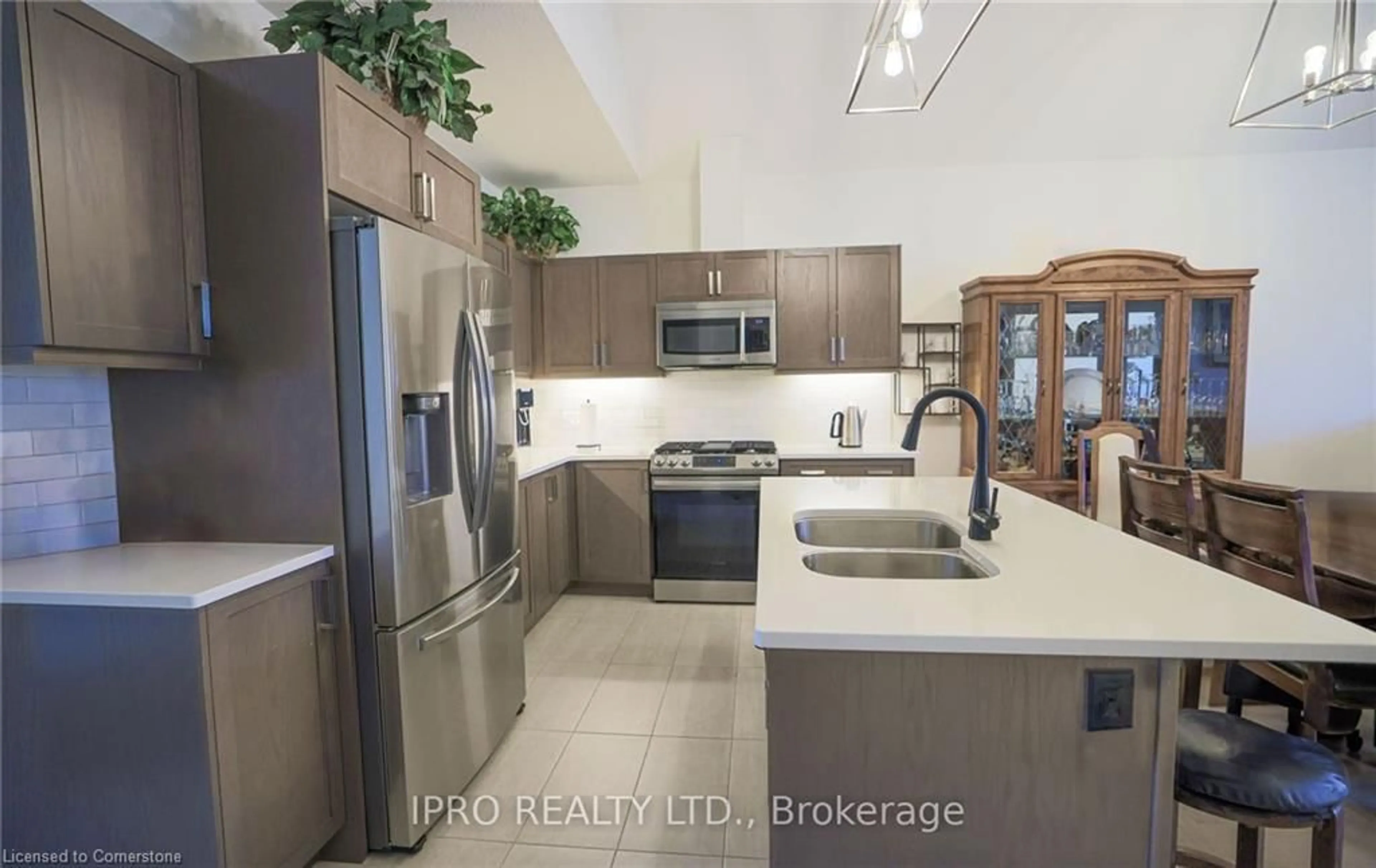 Open concept kitchen, ceramic/tile floor for 63 Compass Trail #7, Port Stanley Ontario N5L 0B8