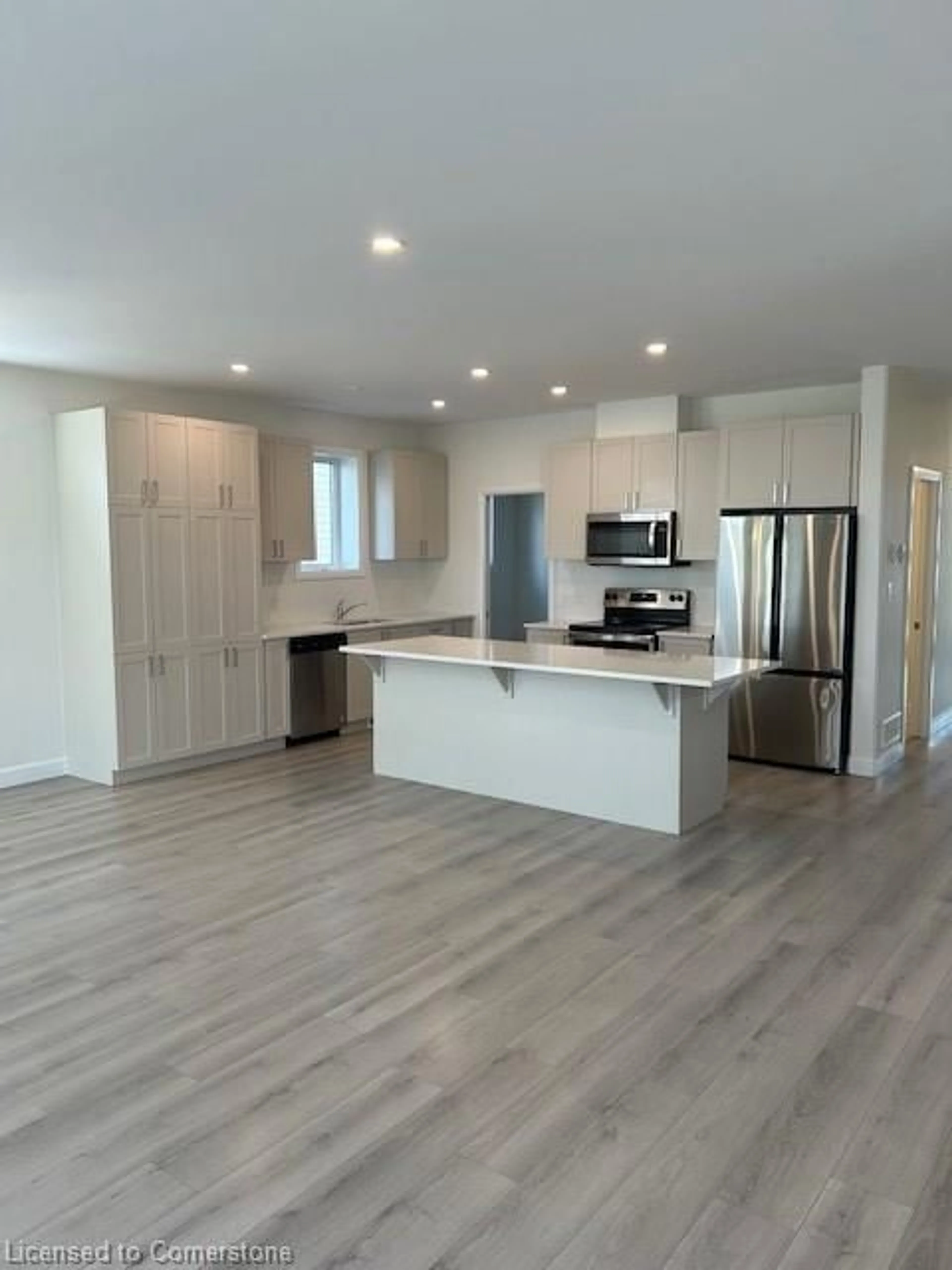 Open concept kitchen, wood/laminate floor for 7 Erie Crt, Amherstview Ontario K0H 1G0