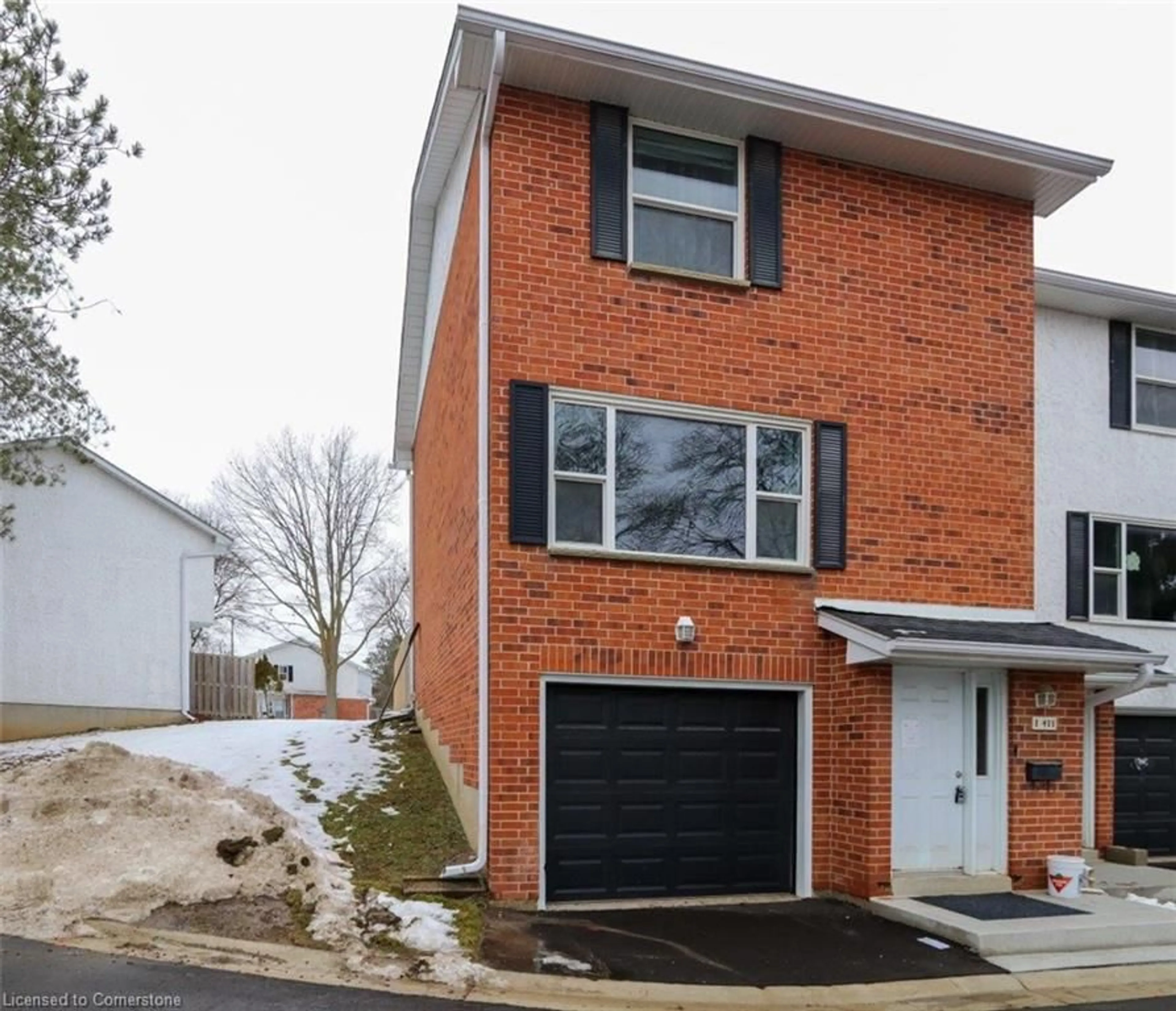 Home with brick exterior material, street for 411 Keats Way #1, Waterloo Ontario N2L 5S7