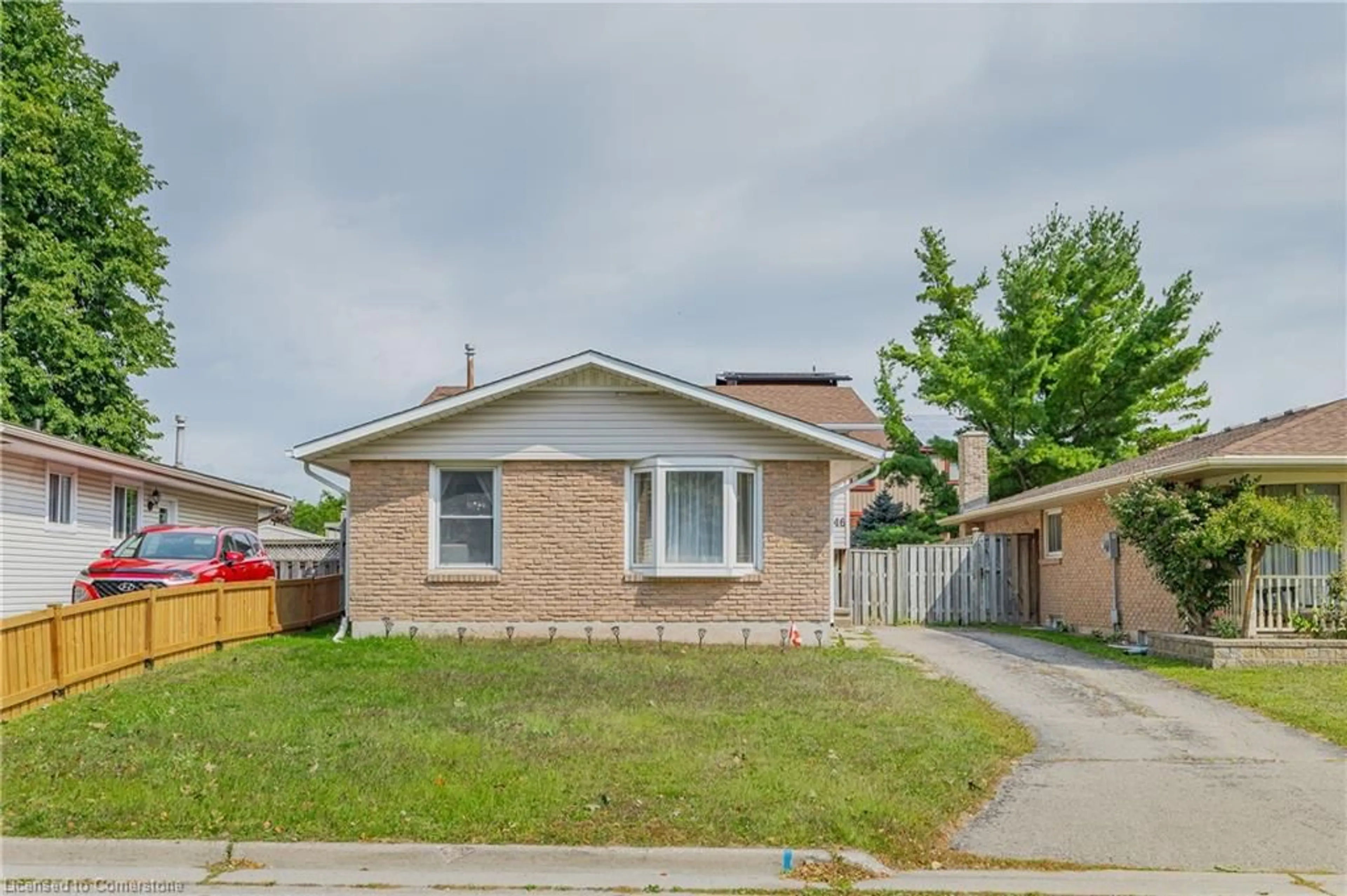 Home with brick exterior material, street for 46 Calmcrest Dr, Kitchener Ontario N2E 1V3