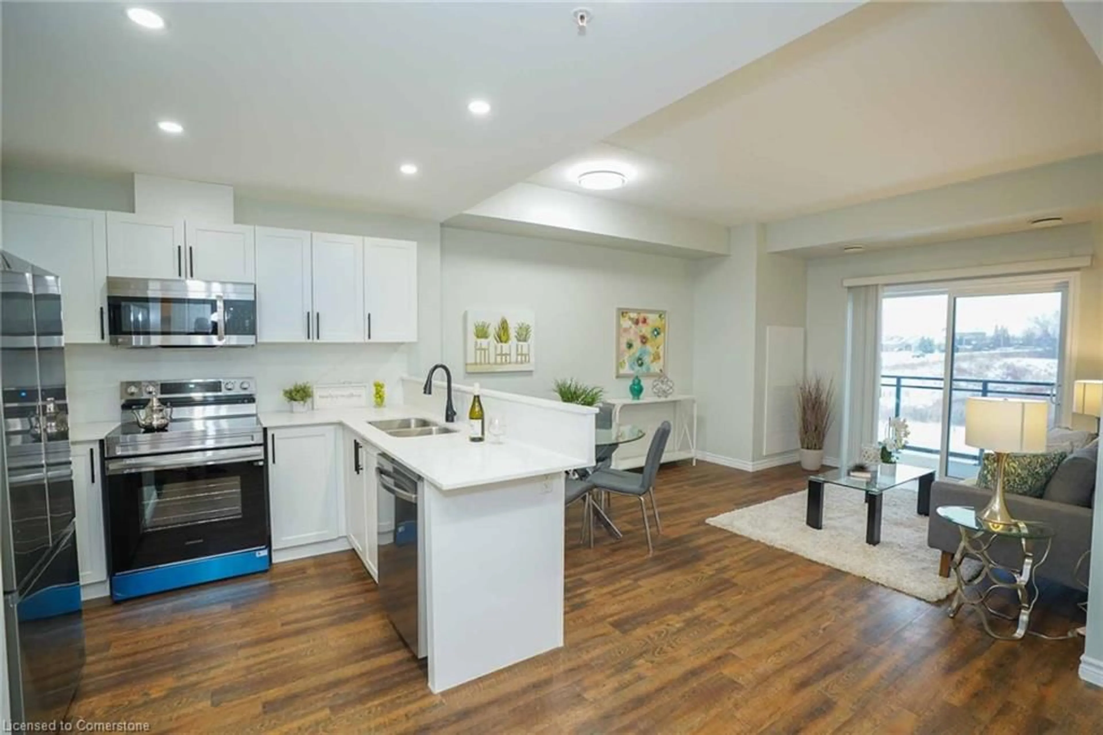 Open concept kitchen, wood/laminate floor for 7 Kay Cres #107, Guelph Ontario N1L 0L9