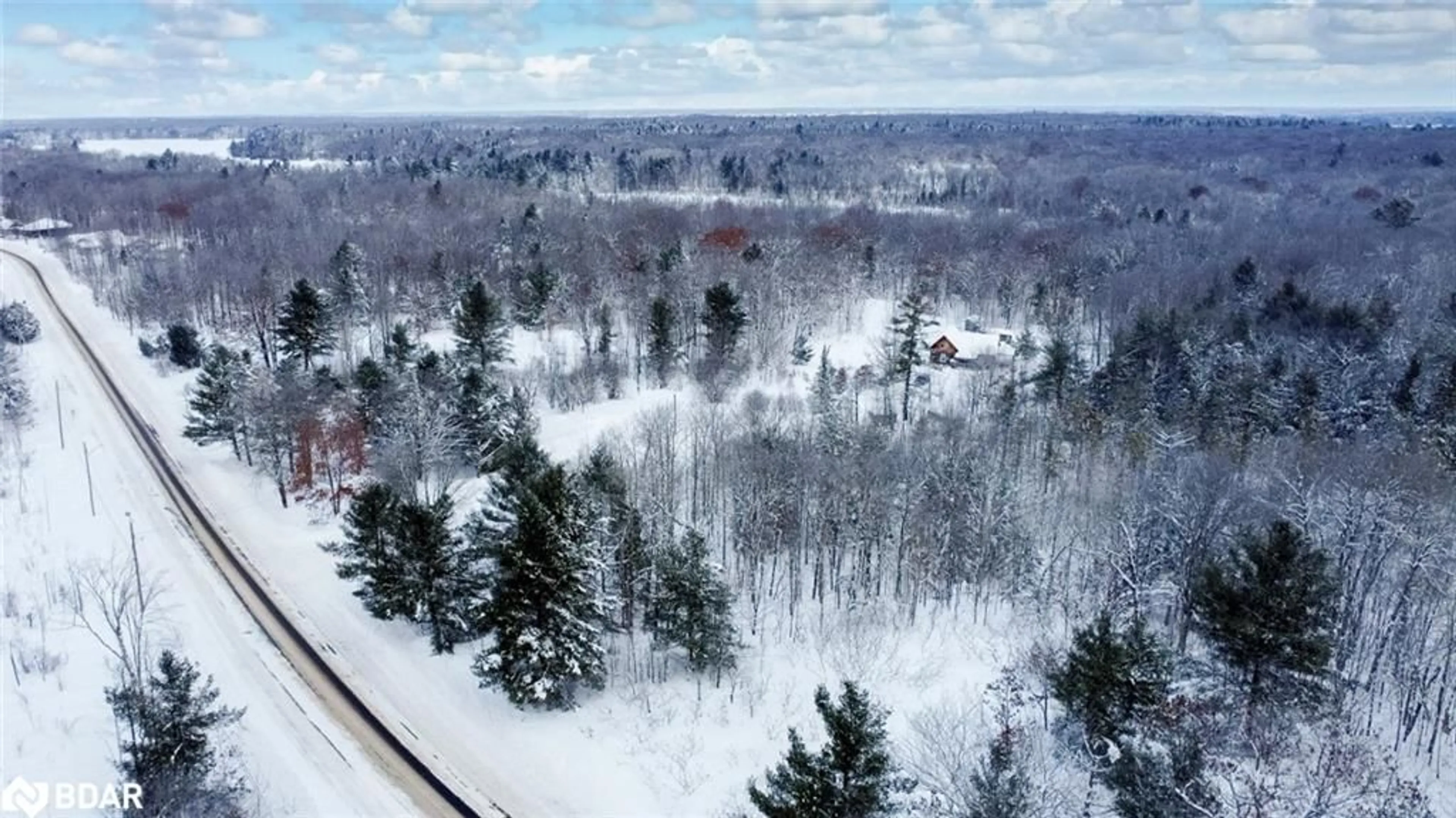 A pic from outside/outdoor area/front of a property/back of a property/a pic from drone, forest/trees view for 94 High St, MacTier Ontario P0C 1H0