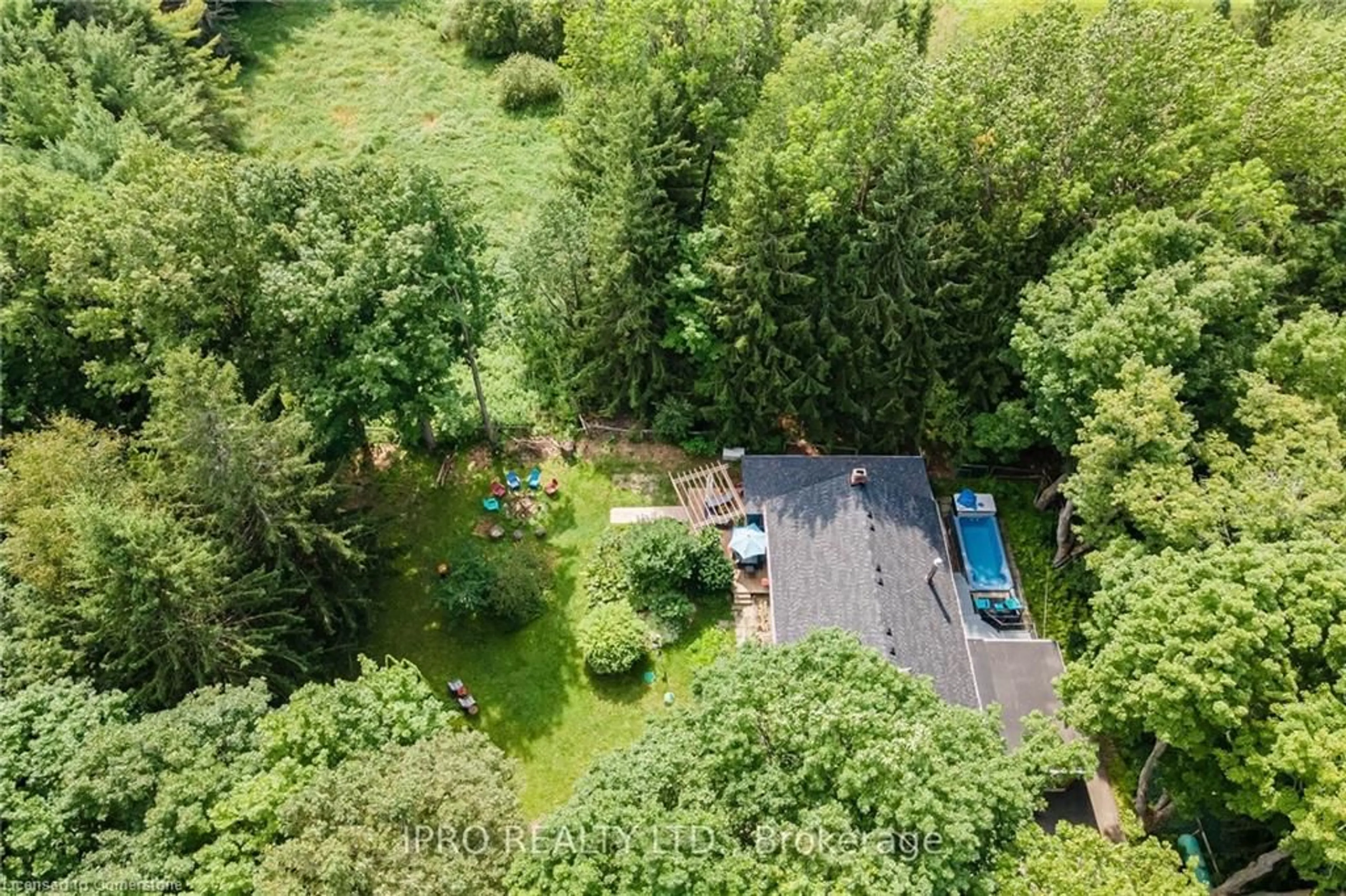 A pic from outside/outdoor area/front of a property/back of a property/a pic from drone, forest/trees view for 715432 1st Line, Mono Ontario K6H 5R5