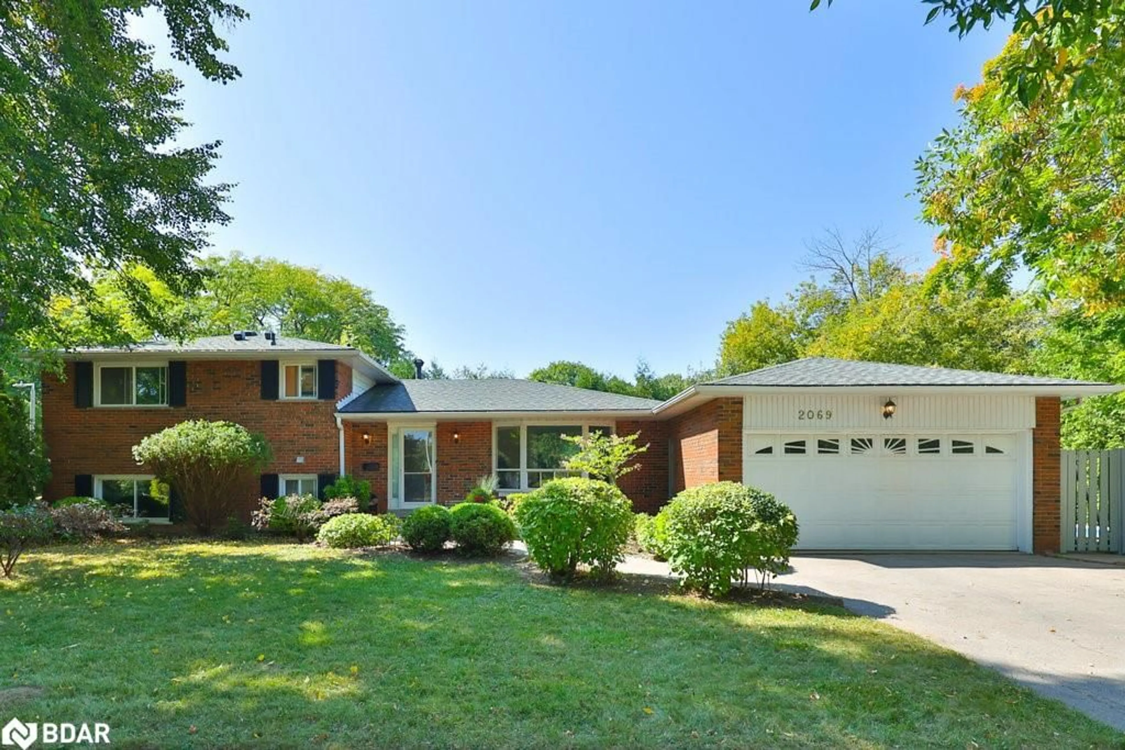 Home with brick exterior material, street for 2069 Thornlea Dr, Oakville Ontario L6L 1K4