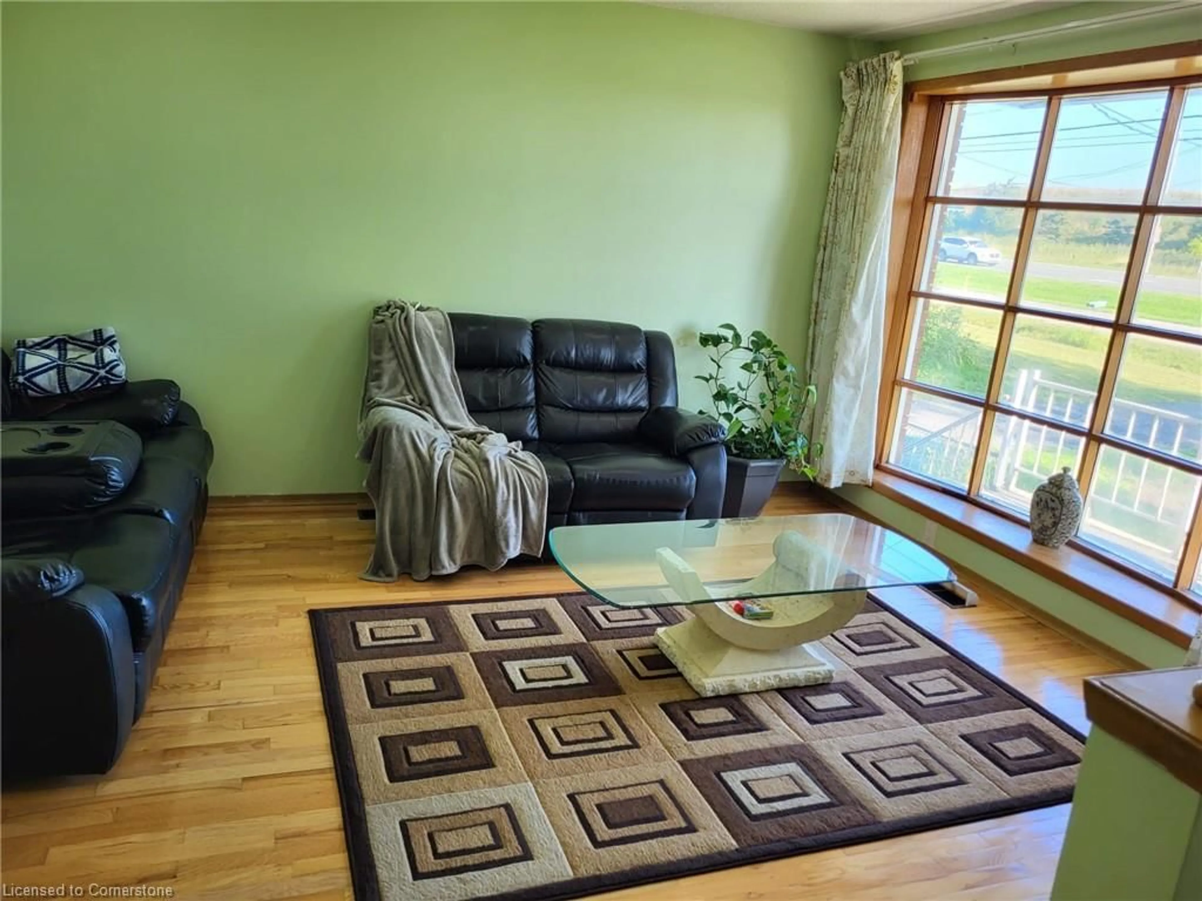 Living room with furniture, wood/laminate floor for 11 Penny Lane, Stoney Creek Ontario L8J 2V7