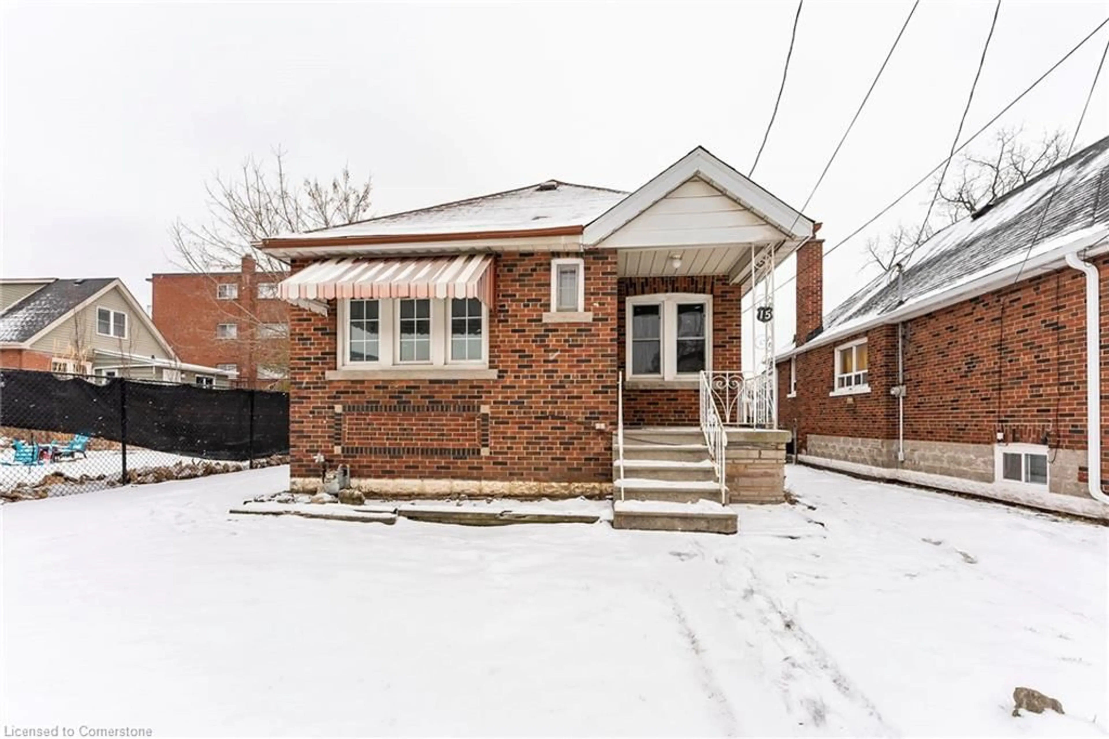 Home with brick exterior material, street for 15 East 12th St, Hamilton Ontario L9A 3X2