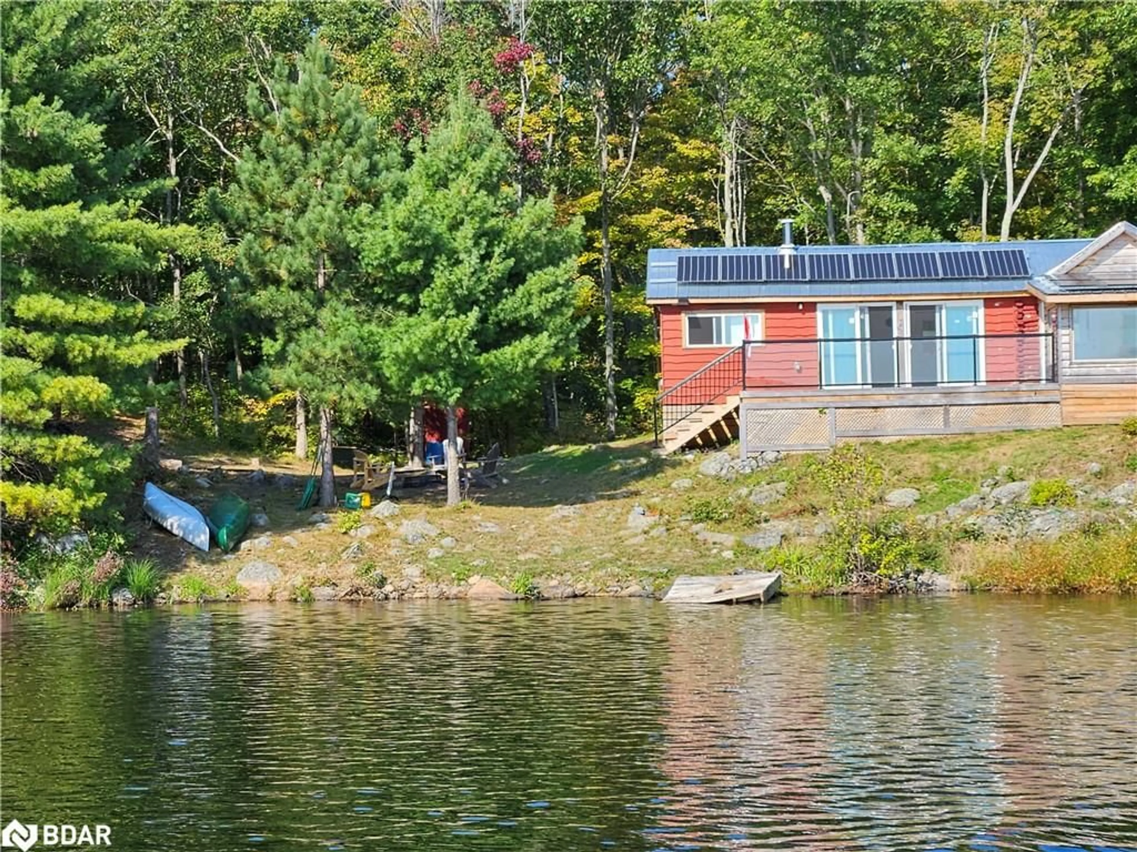 A pic from outside/outdoor area/front of a property/back of a property/a pic from drone, water/lake/river/ocean view for 2035C Fifth Lake Rd, Sharbot Lake Ontario K0H 2K0