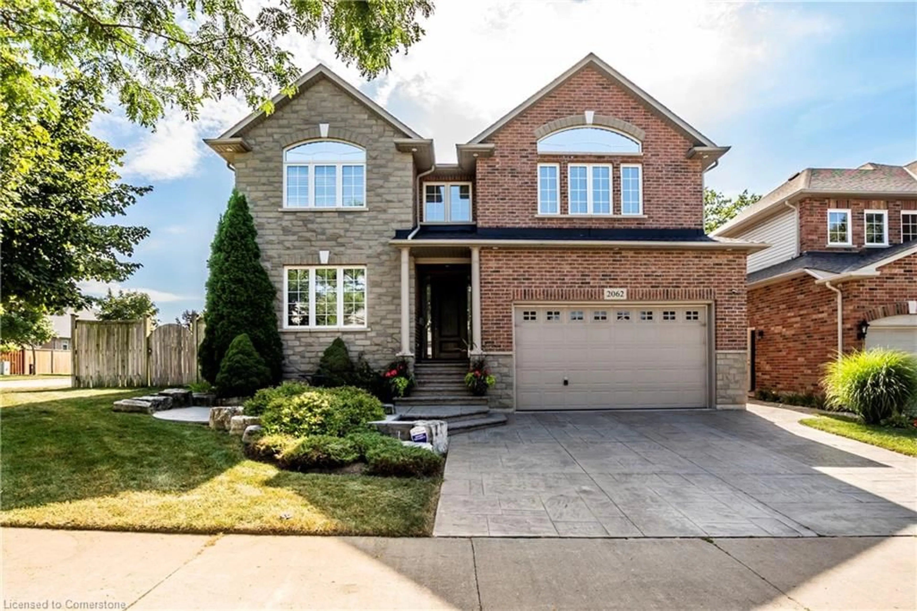 Home with brick exterior material, street for 2062 Gordie Tapp Cres, Burlington Ontario L7M 4X9