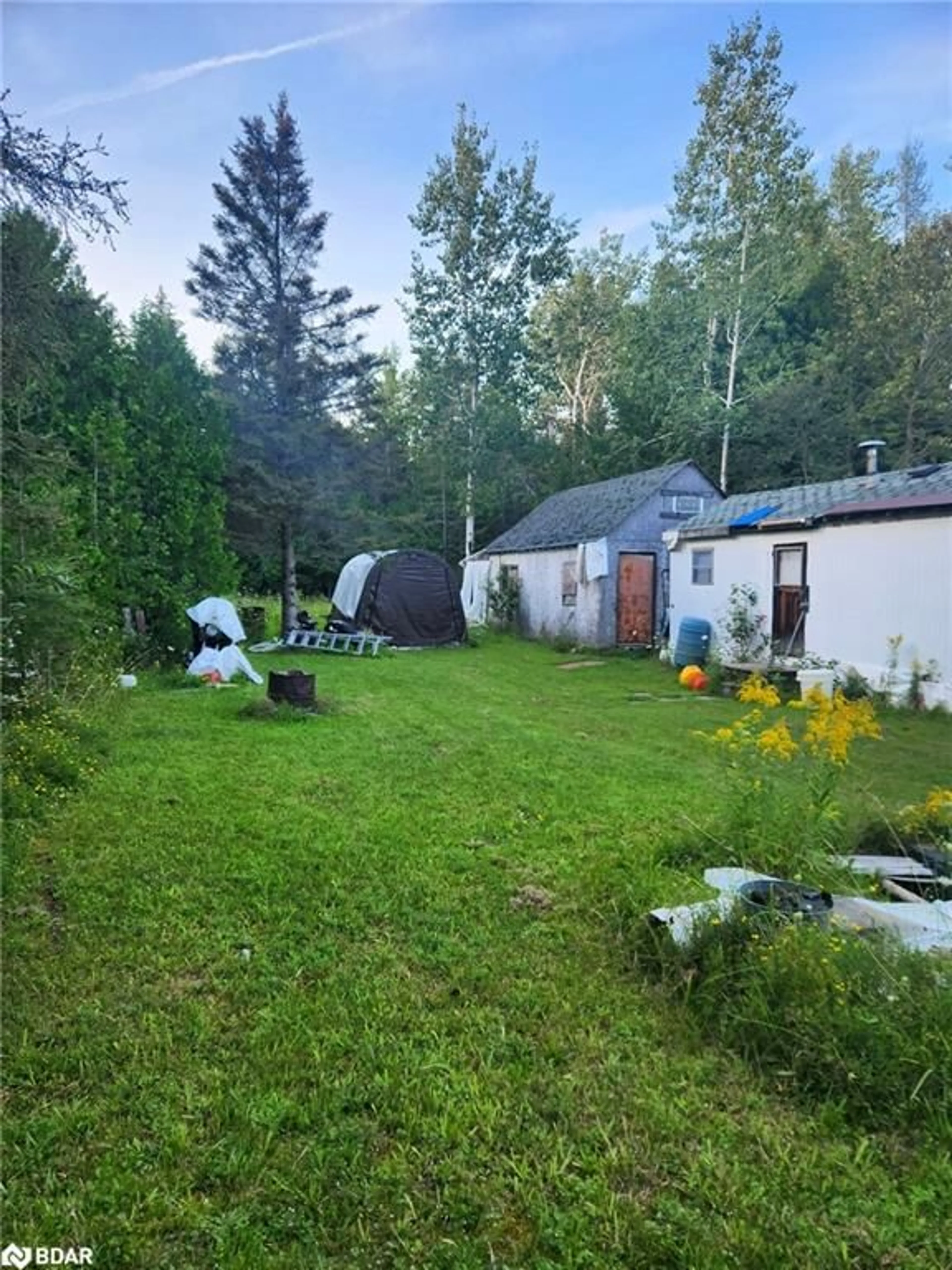 A pic from outside/outdoor area/front of a property/back of a property/a pic from drone, forest/trees view for 20250 Hwy 540, Silver Water Ontario P0P 1H0