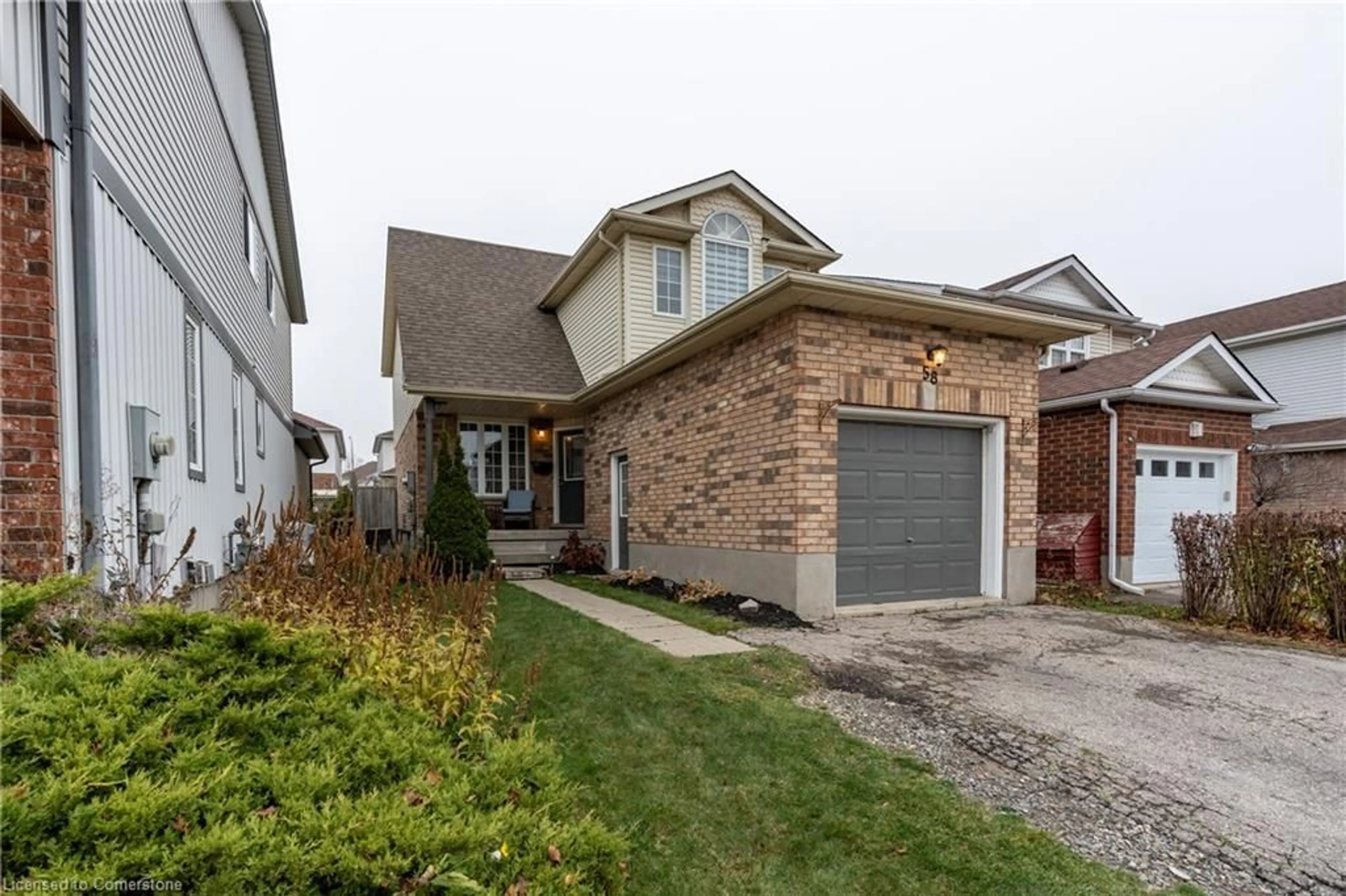 Home with brick exterior material, street for 58 Bush Clover Cres, Kitchener Ontario N2E 3P9