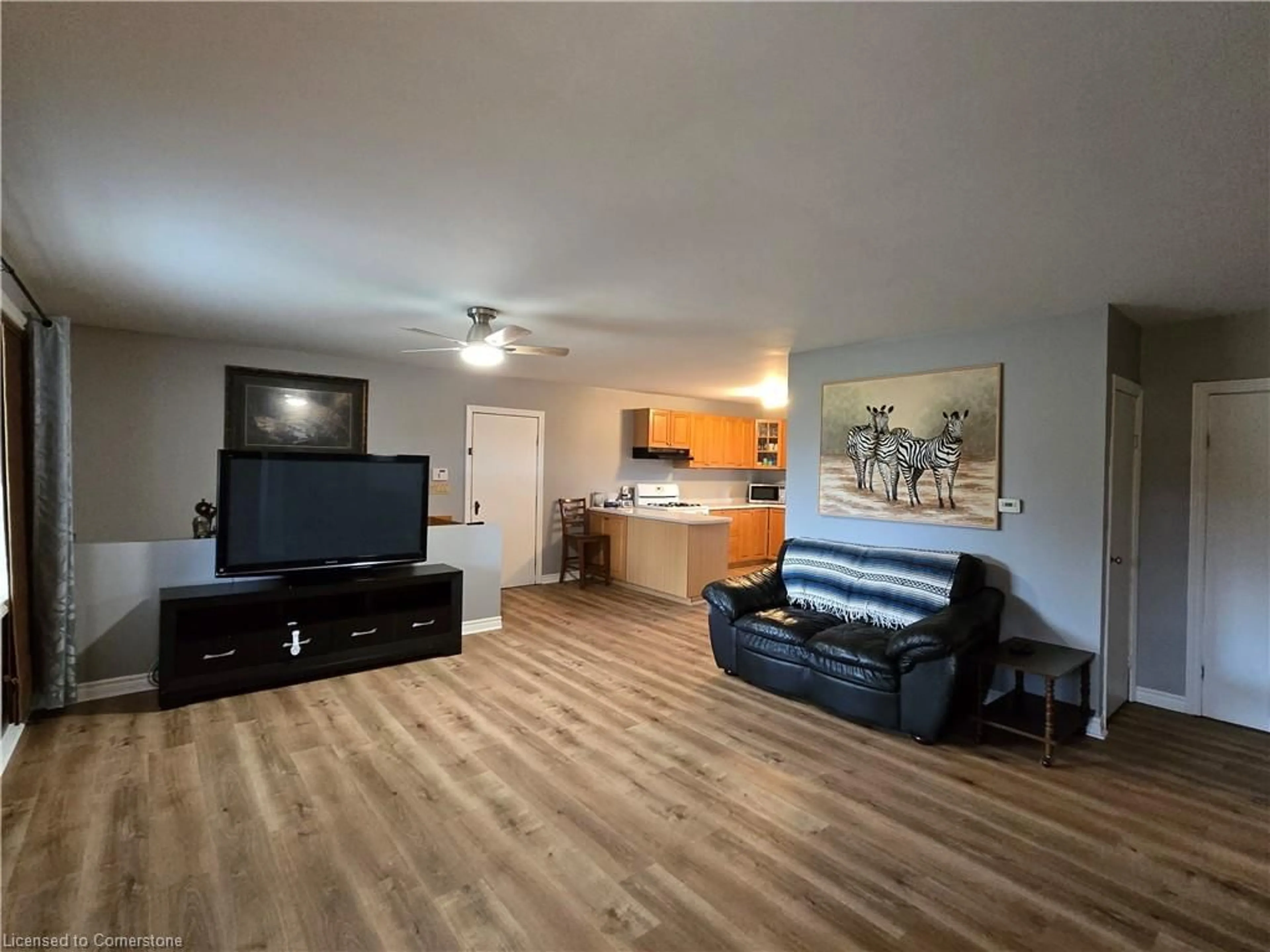 Living room with furniture, wood/laminate floor for 1060 Front Rd, Booth's Harbour Ontario N0E 1P0