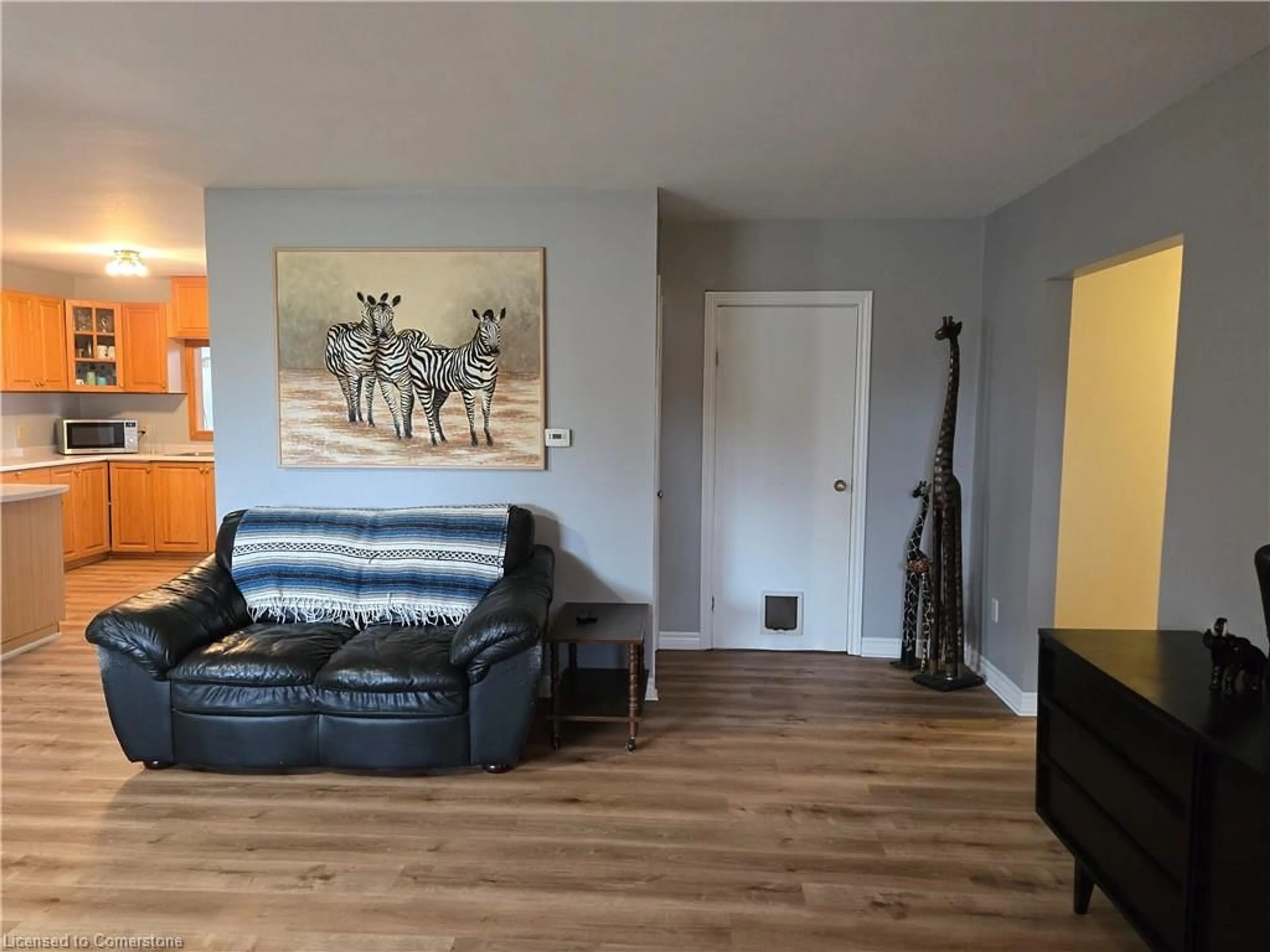 Living room with furniture, wood/laminate floor for 1060 Front Rd, Booth's Harbour Ontario N0E 1P0