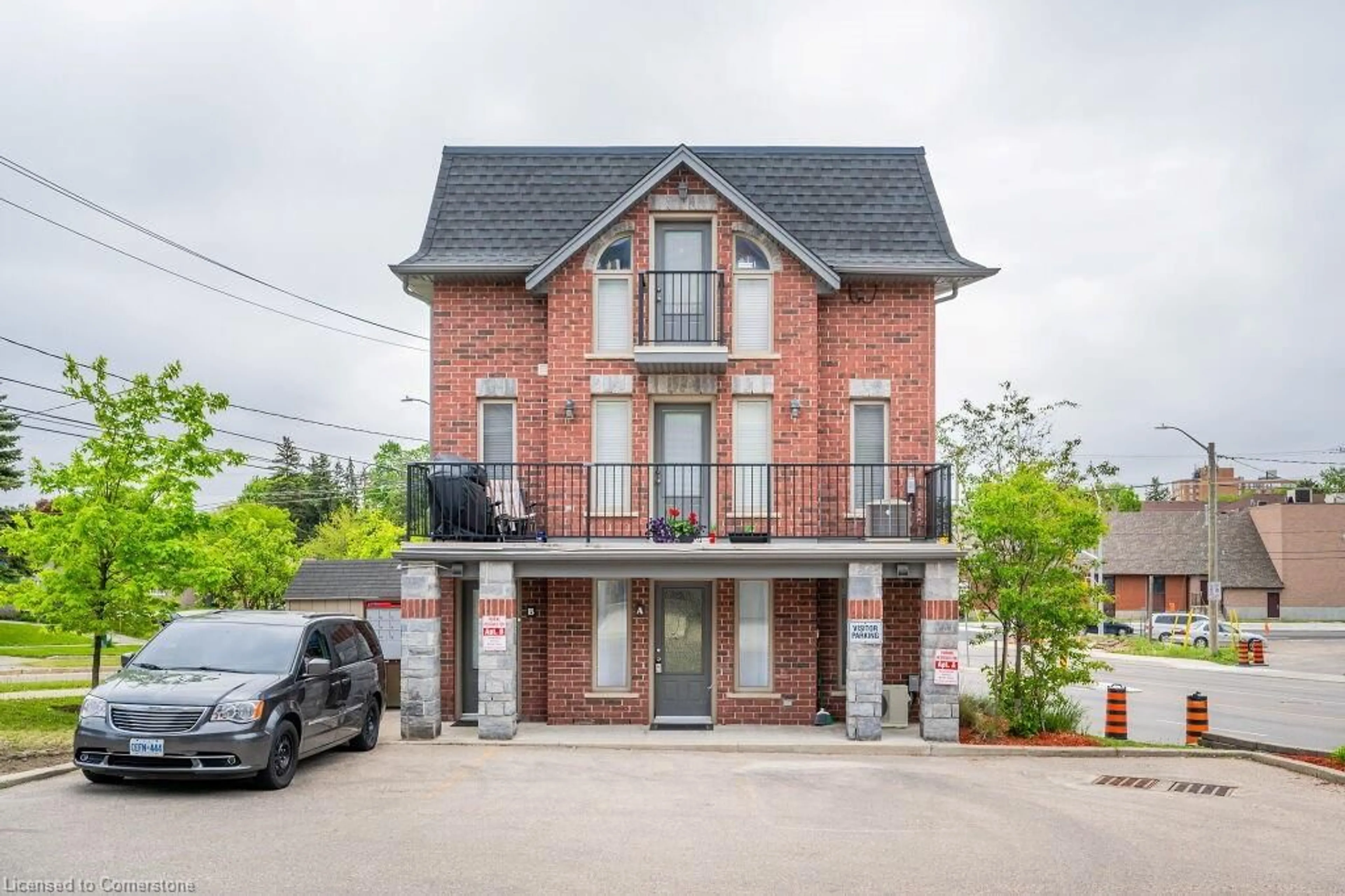 Home with brick exterior material, street for 489 East Ave #A, Kitchener Ontario N2H 1Z7