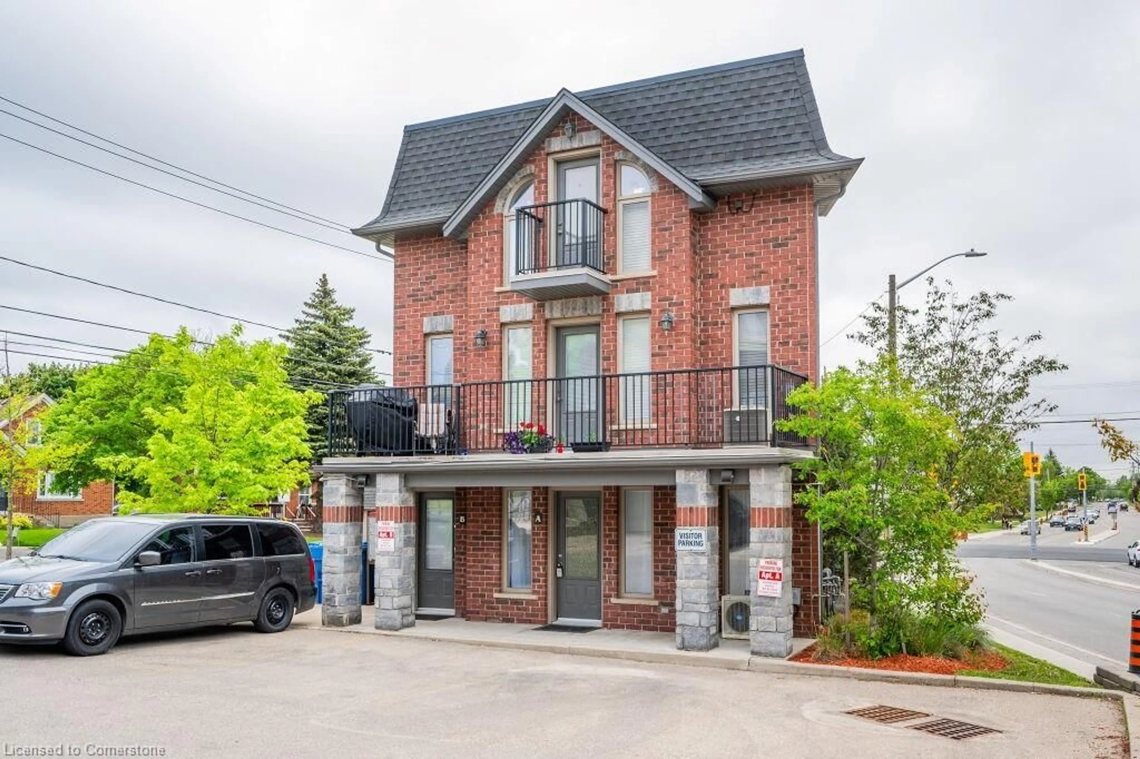 Home with brick exterior material, street for 489 East Ave #A, Kitchener Ontario N2H 1Z7