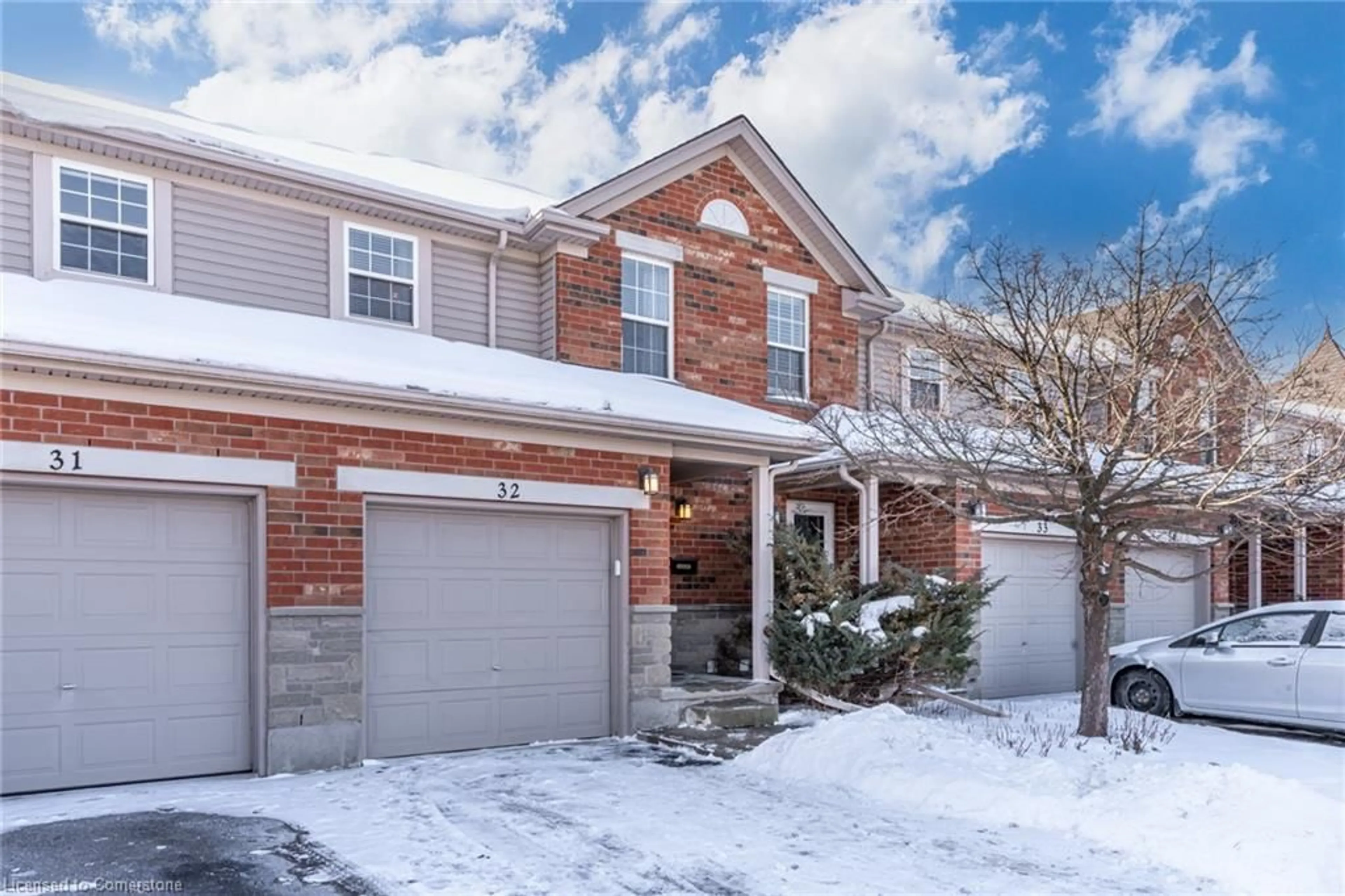 Home with brick exterior material, street for 124 Gosling Gardens #32, Guelph Ontario N1G 5K6