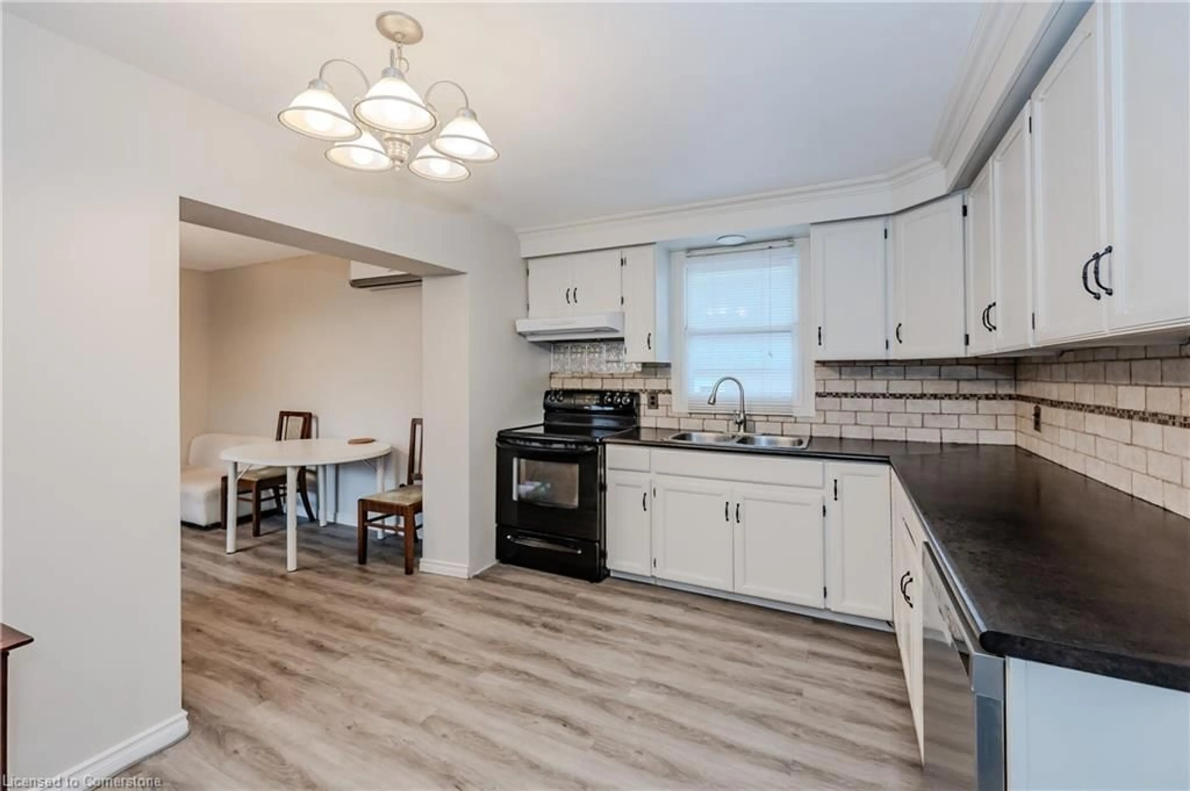 Open concept kitchen, wood/laminate floor for 15 Todd St, Cambridge Ontario N1R 1G6