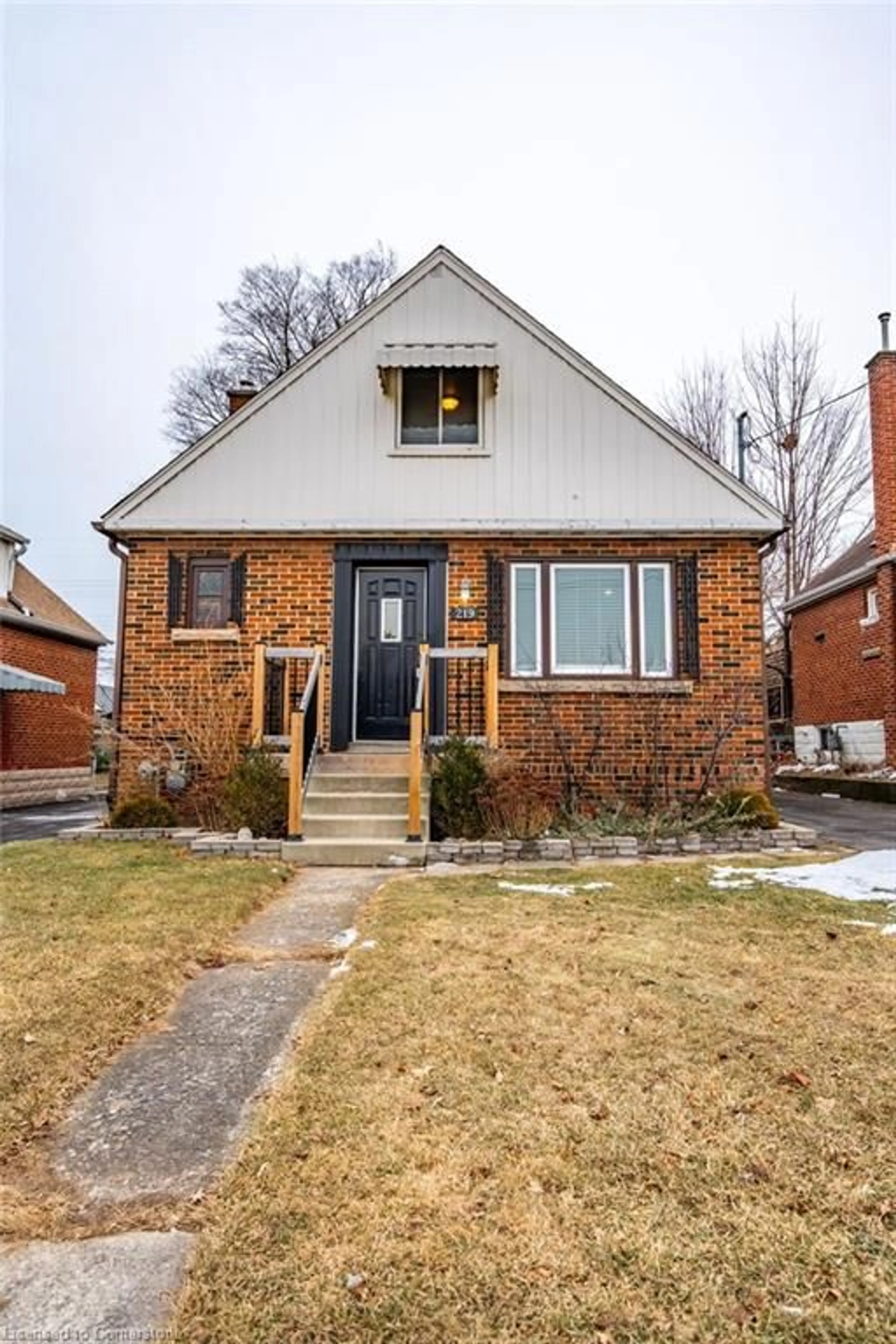 Home with brick exterior material, street for 219 Rodgers Rd, Hamilton Ontario L8K 3C3