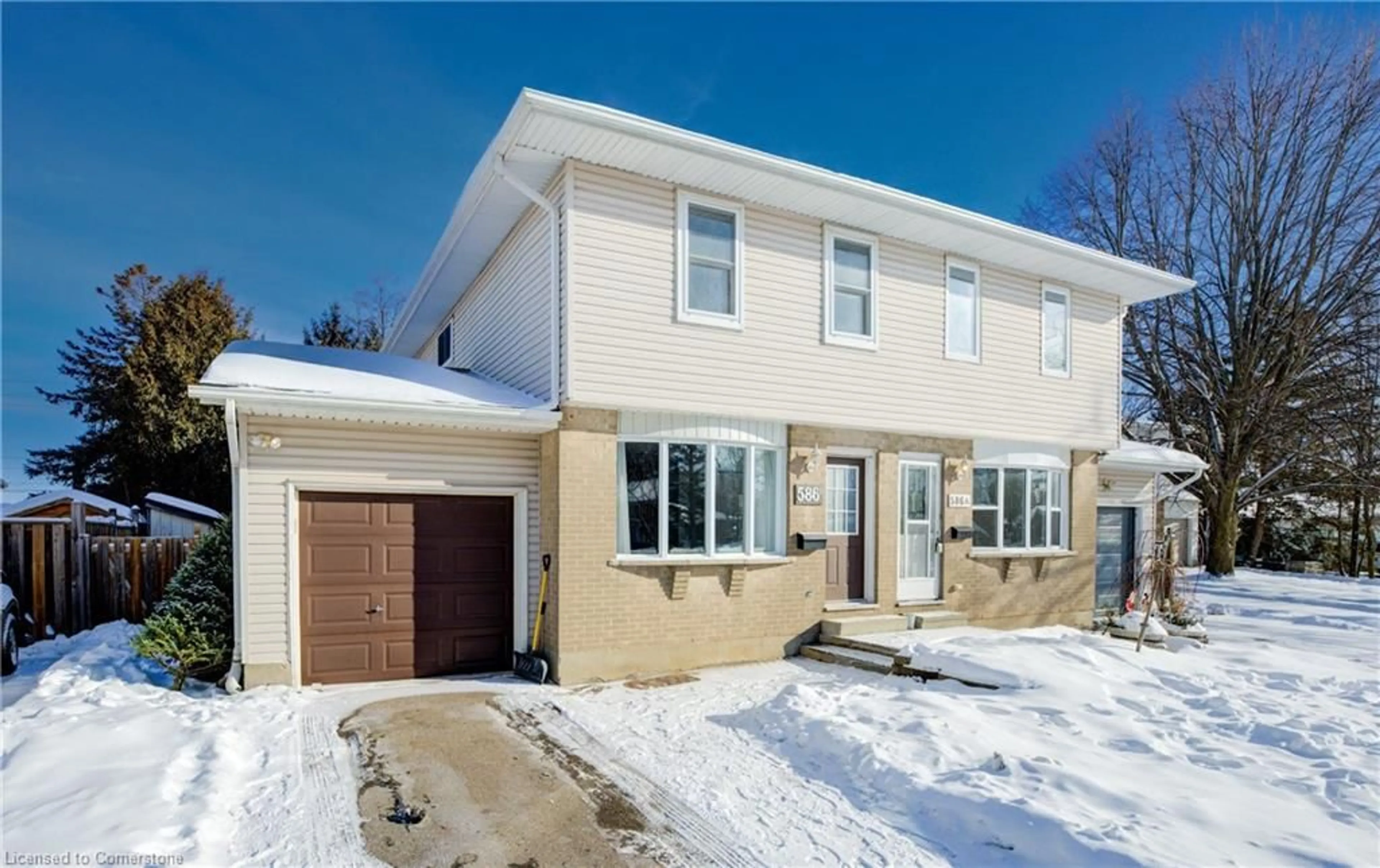 Home with brick exterior material, street for 586 Mount Anne Dr #B, Waterloo Ontario N2L 4W3