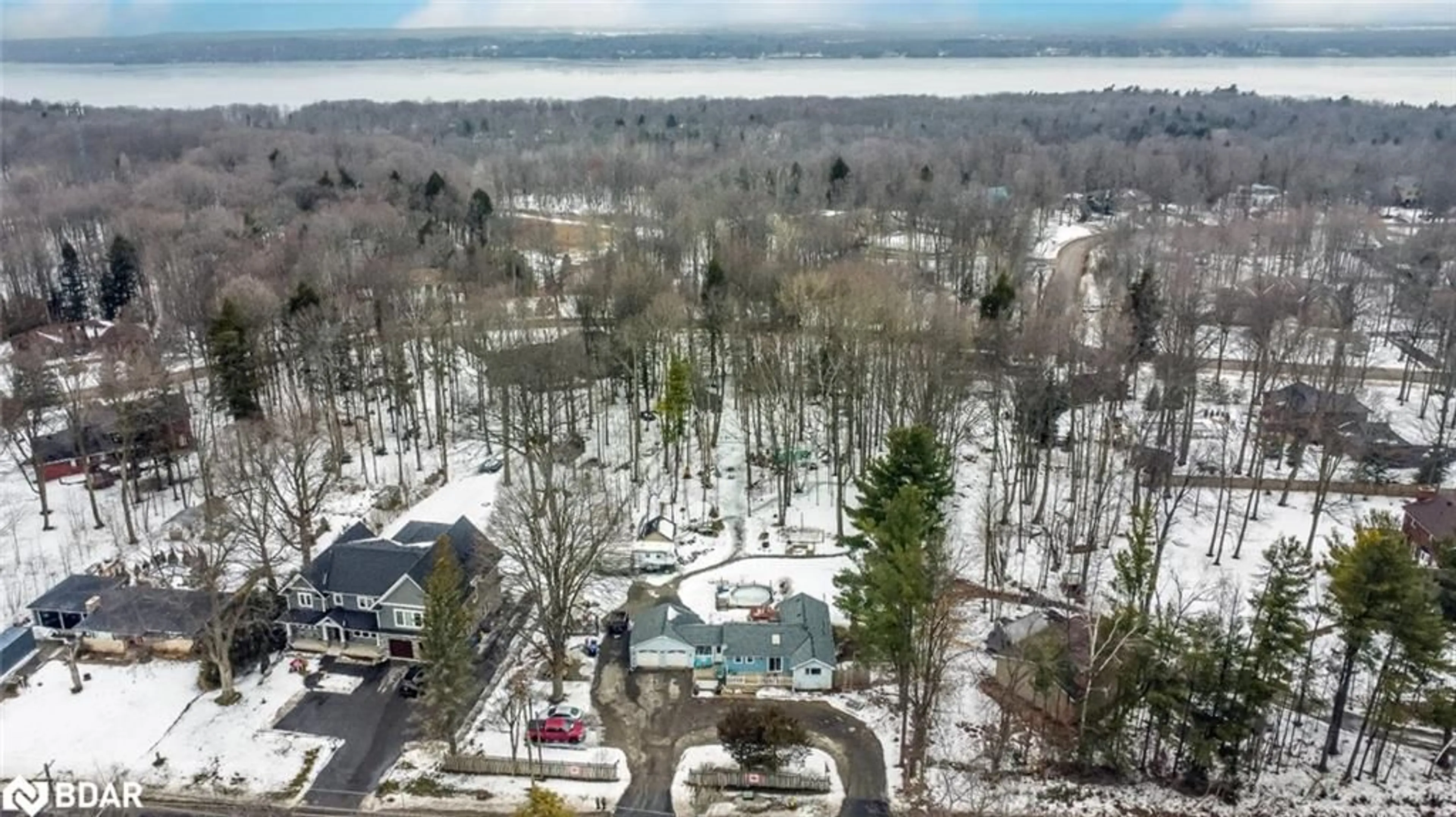 A pic from outside/outdoor area/front of a property/back of a property/a pic from drone, forest/trees view for 1776 Big Bay Point Rd, Innisfil Ontario L9S 2R4