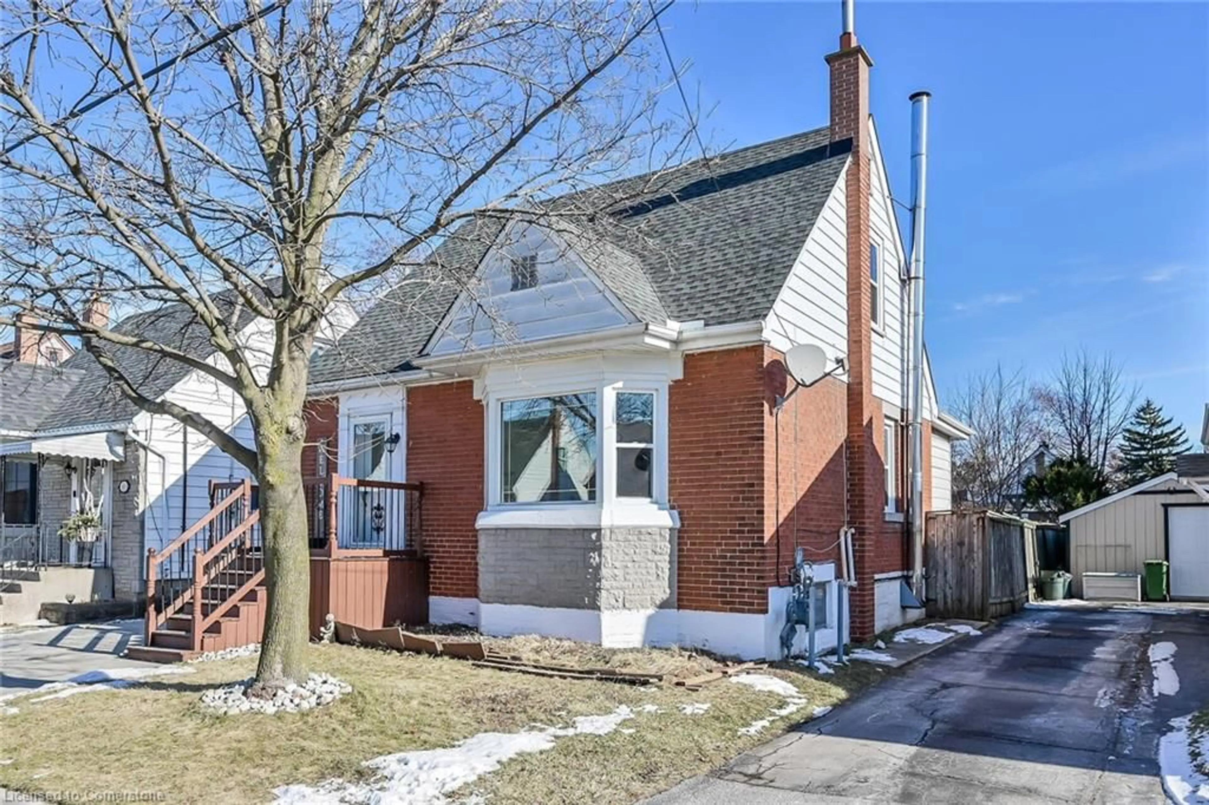 Home with brick exterior material, street for 97 East 12th St, Hamilton Ontario L9A 3X3