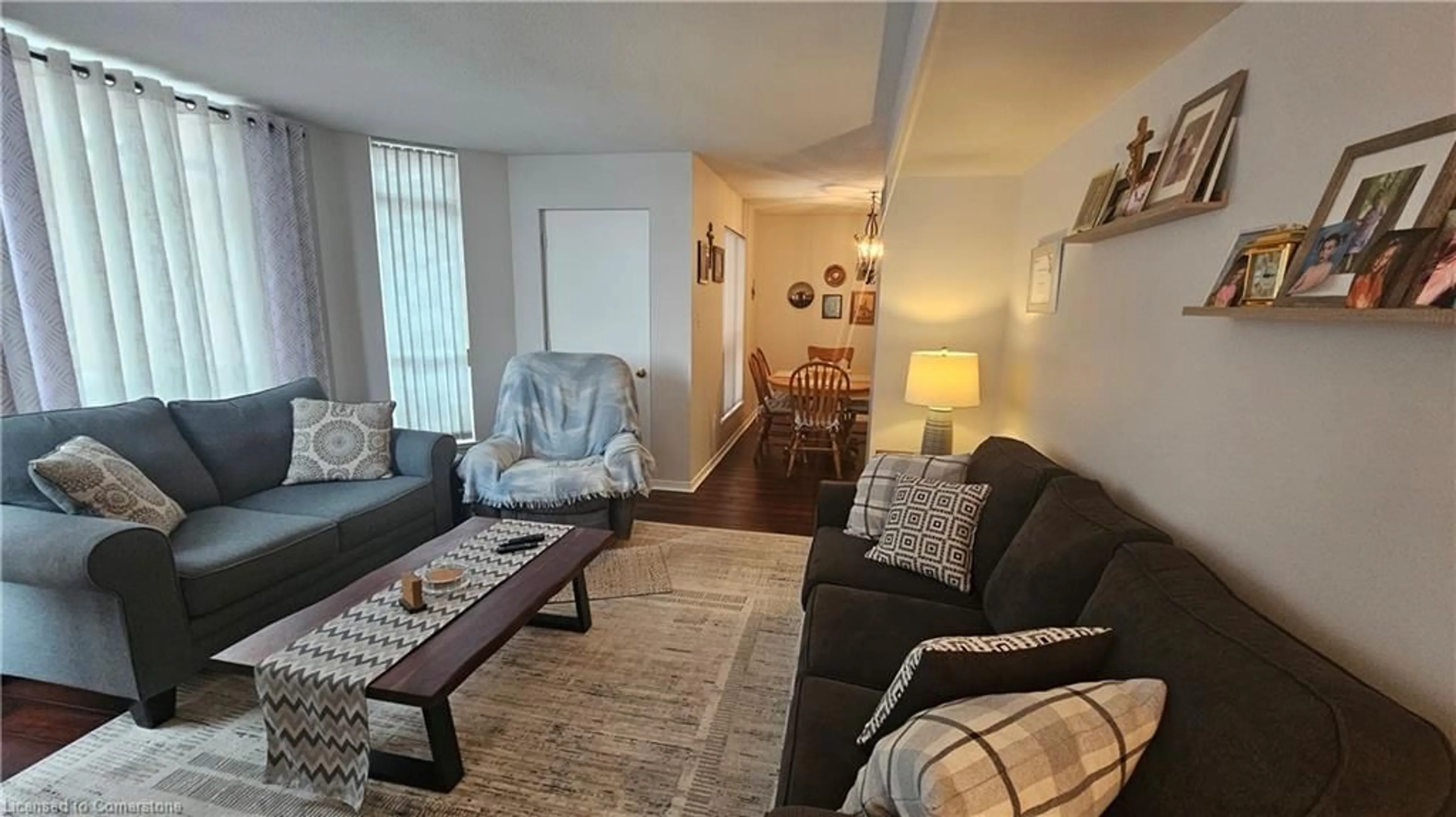 Living room with furniture, wood/laminate floor for 1414 King St #206, Kitchener Ontario N2G 4T8