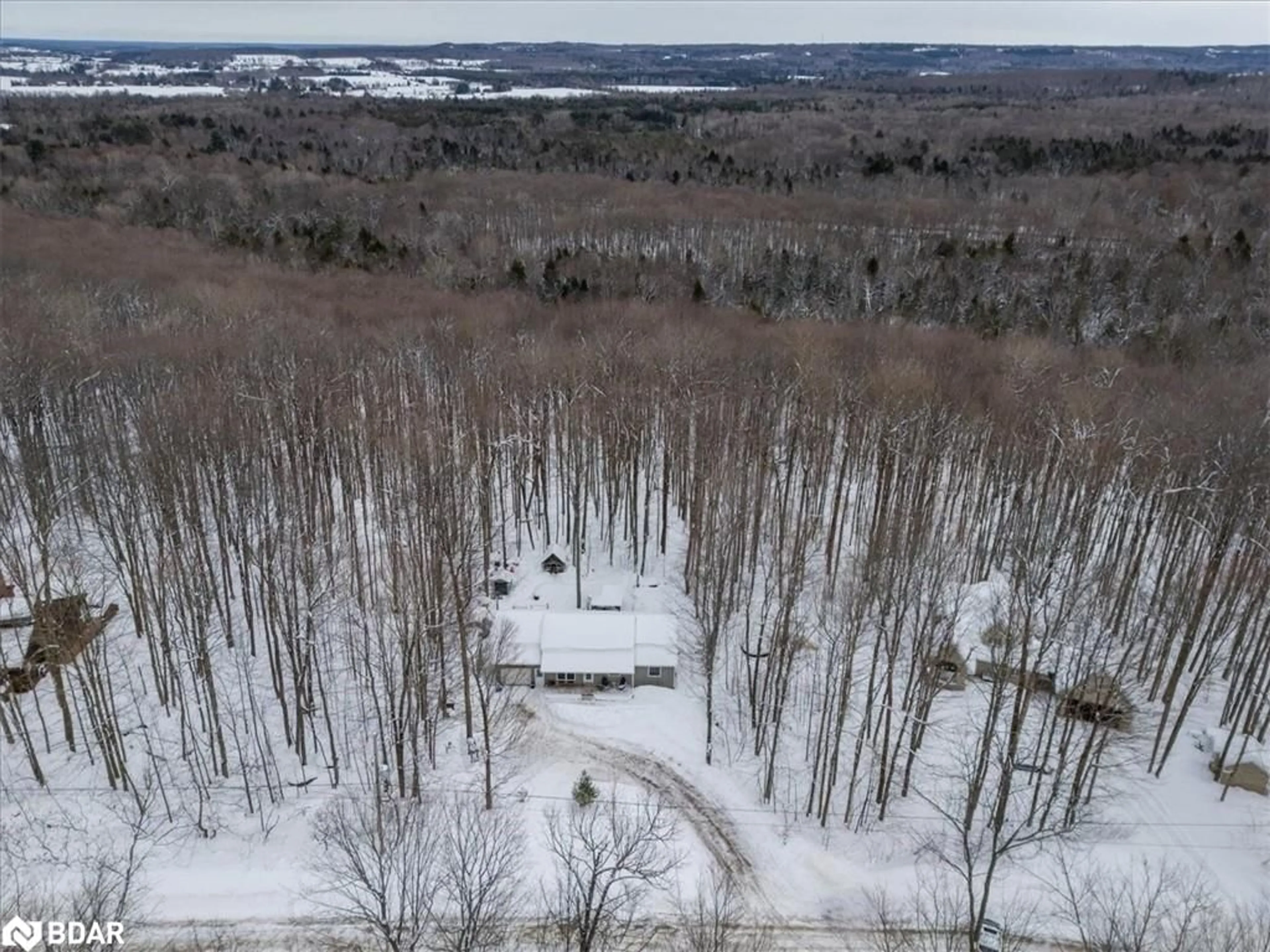 A pic from outside/outdoor area/front of a property/back of a property/a pic from drone, forest/trees view for 5 Snowshoe Trail, Moonstone Ontario L0K 1N0