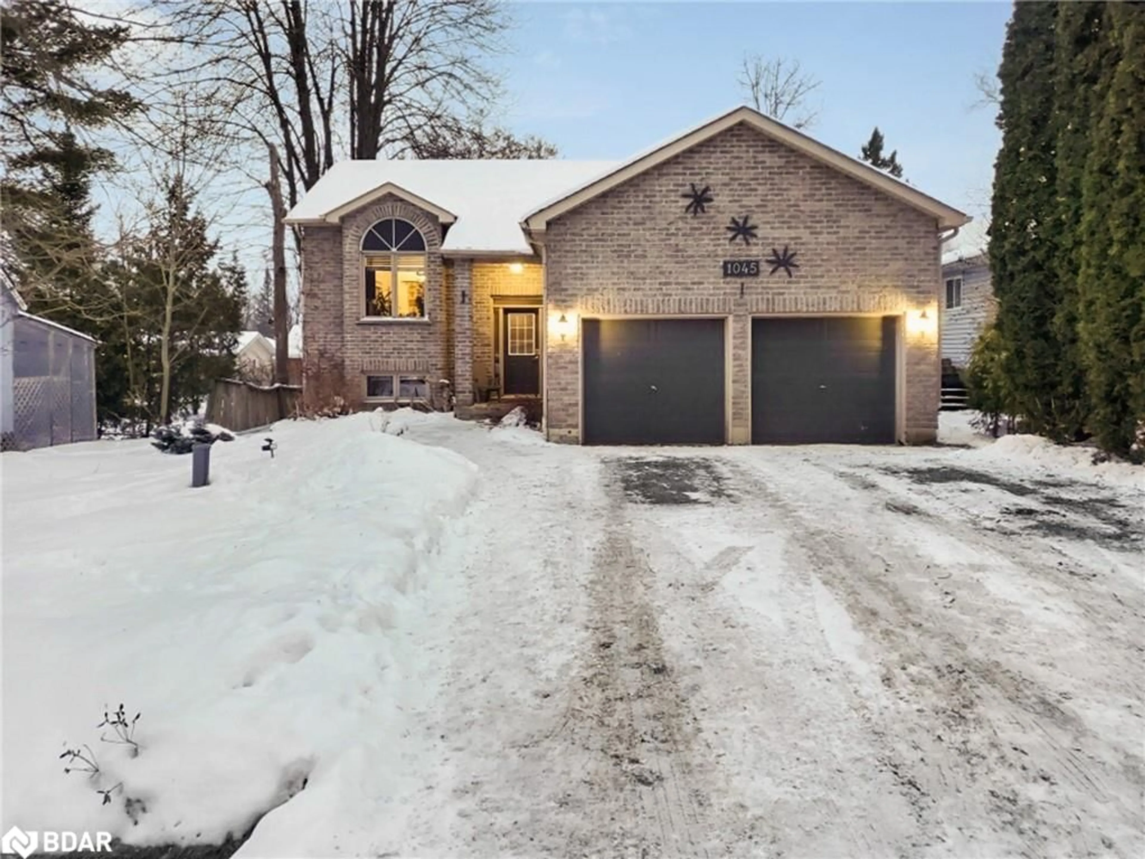 Home with brick exterior material, street for 1045 Elm Road, Innisfil Ontario L0L 1C0