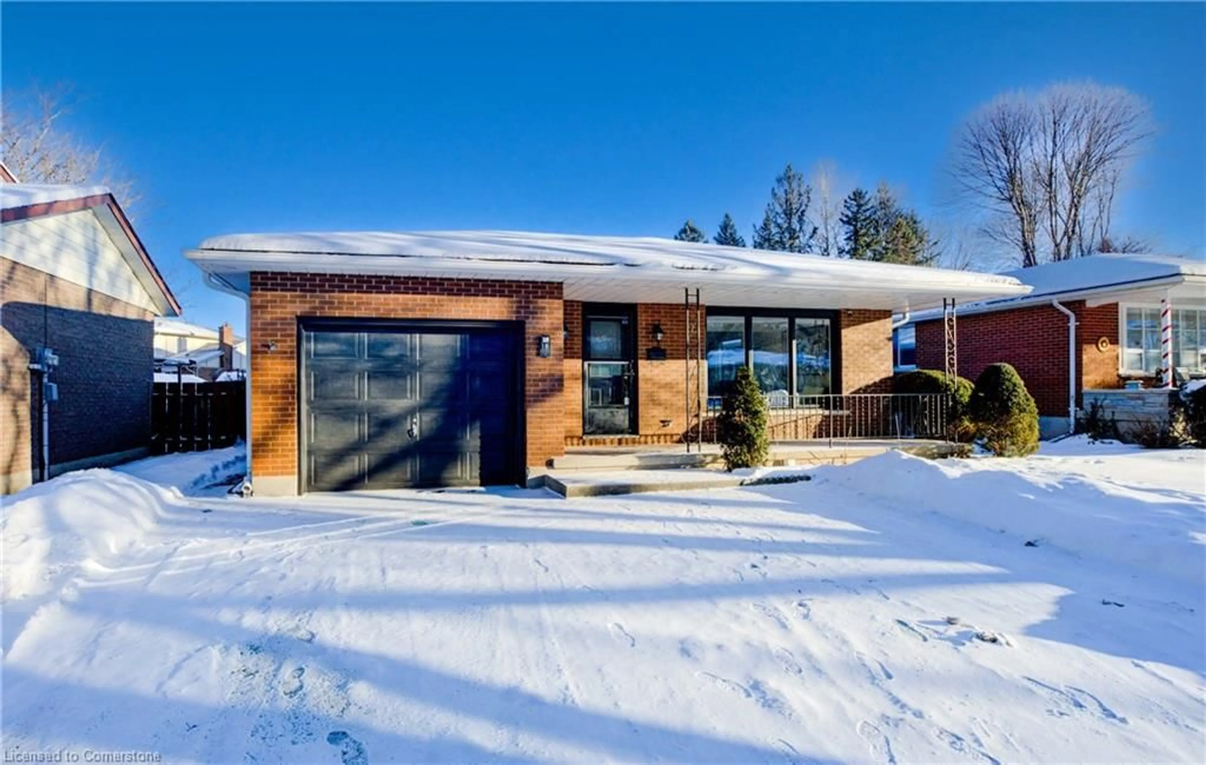 Home with brick exterior material, street for 18 Martinglen Cres, Kitchener Ontario N2E 2A2