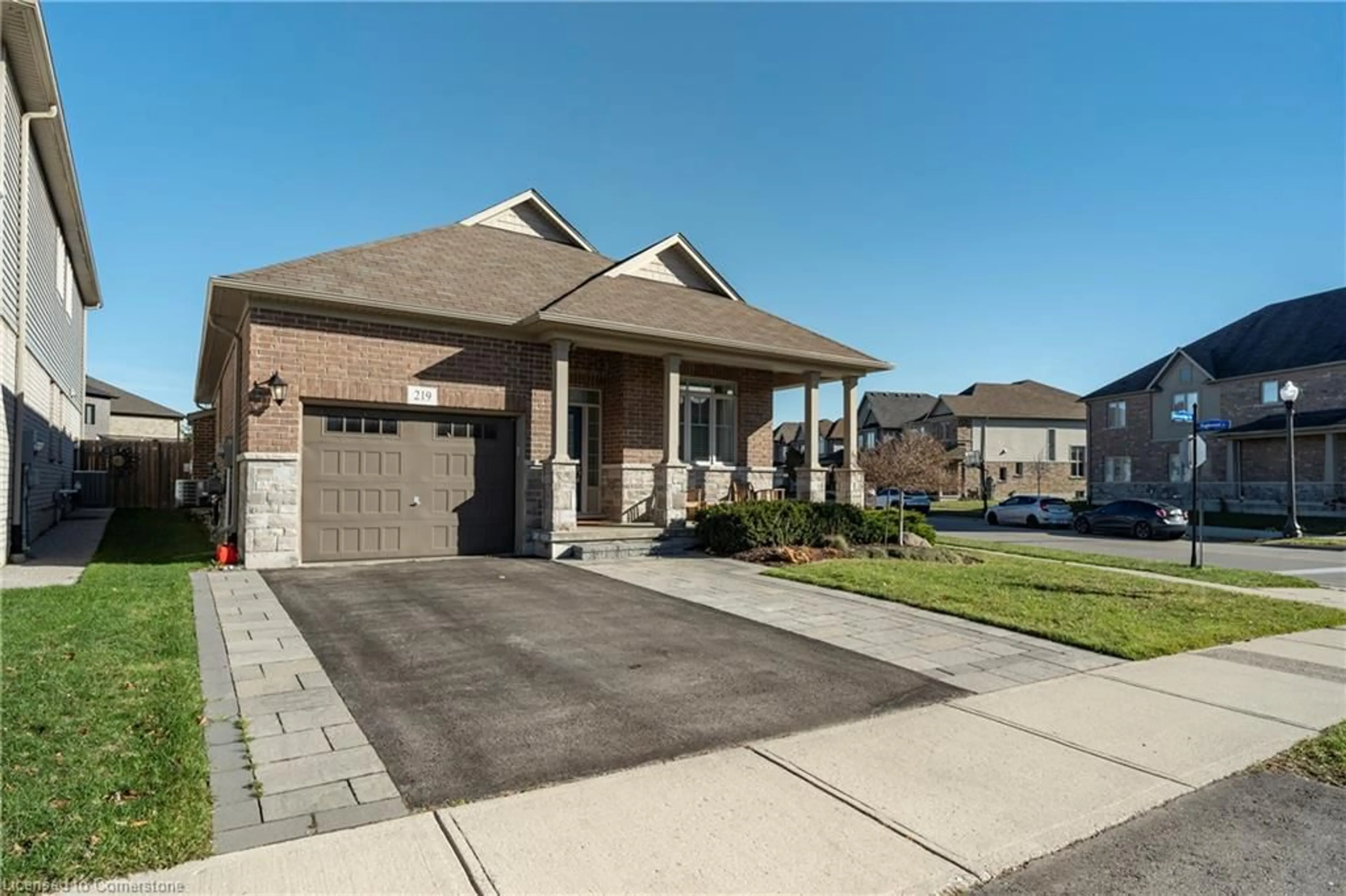 Home with brick exterior material, street for 219 Falconridge Dr, Kitchener Ontario N2K 0B6