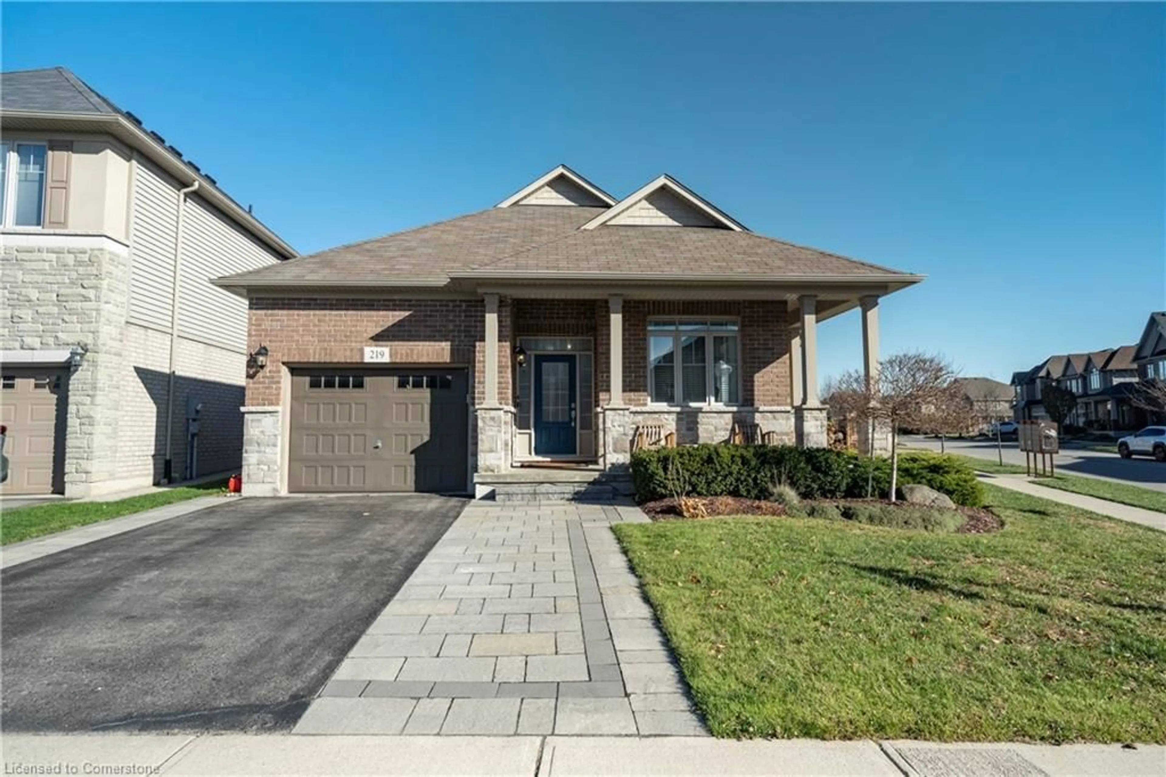 Home with brick exterior material, street for 219 Falconridge Dr, Kitchener Ontario N2K 0B6