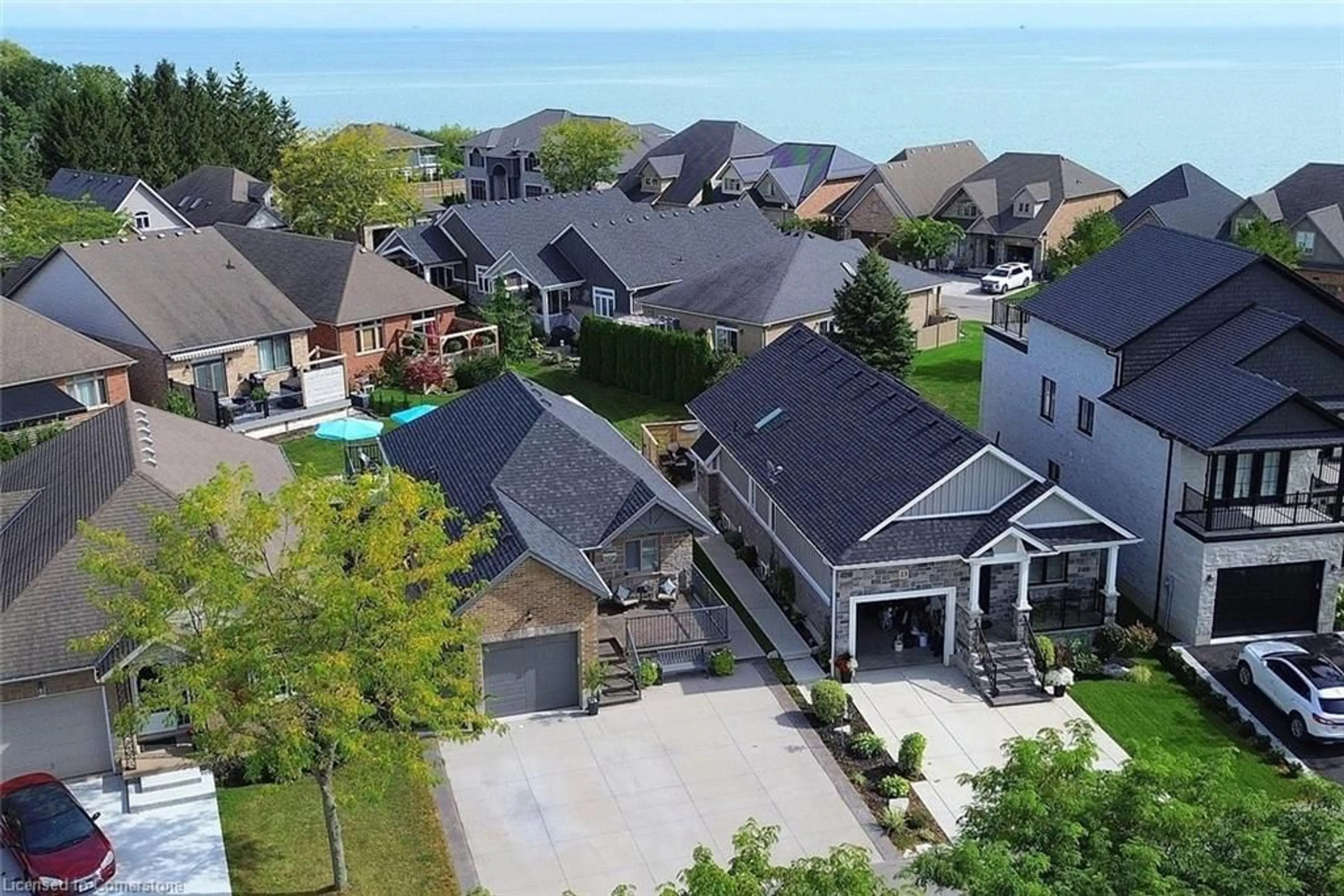 A pic from outside/outdoor area/front of a property/back of a property/a pic from drone, water/lake/river/ocean view for 80 New Lakeshore Rd #24, Port Dover Ontario N0A 1N8