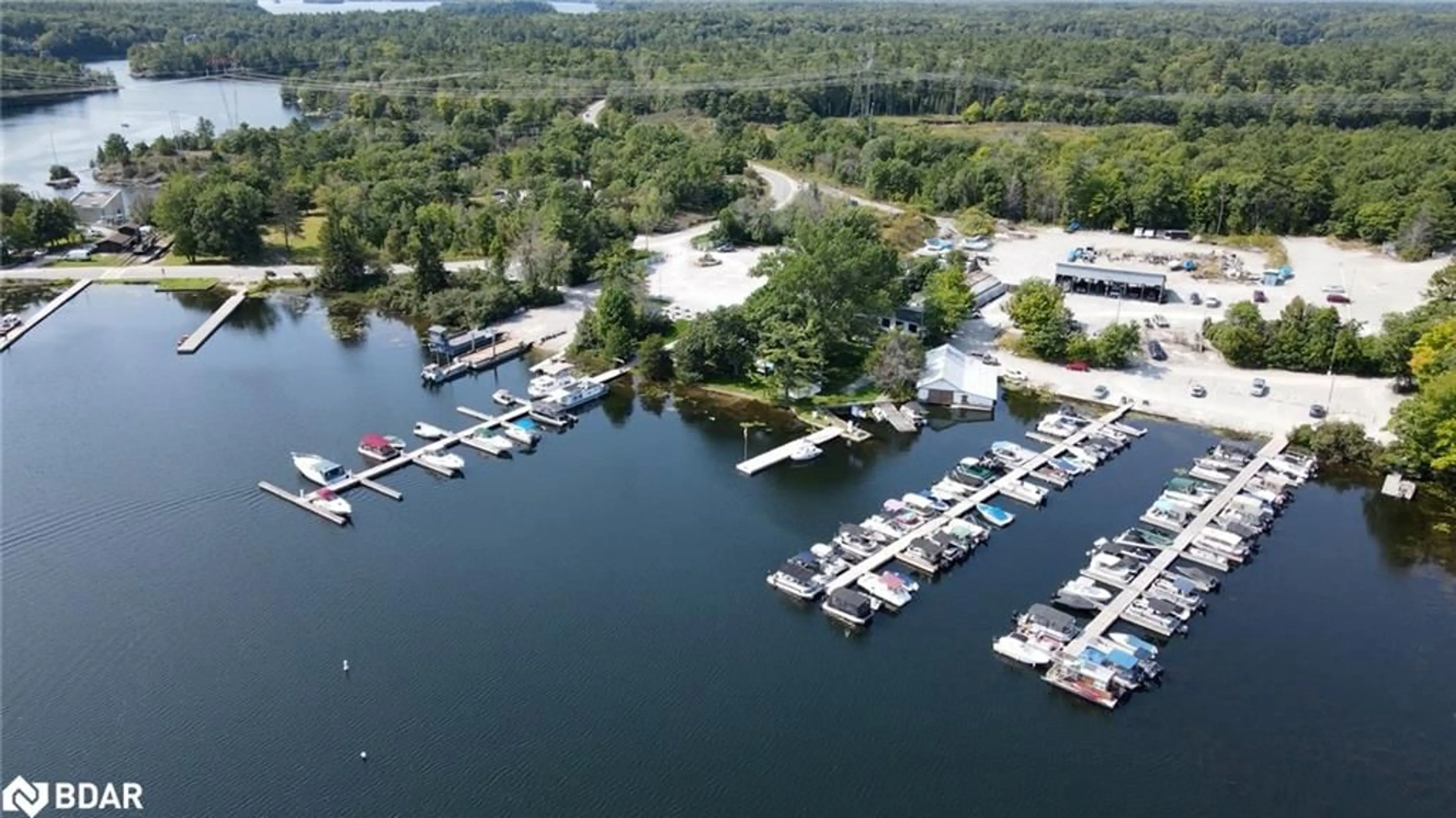 A pic from outside/outdoor area/front of a property/back of a property/a pic from drone, water/lake/river/ocean view for 4372 Conners Bay Lane, Coldwater Ontario L0K 1E0