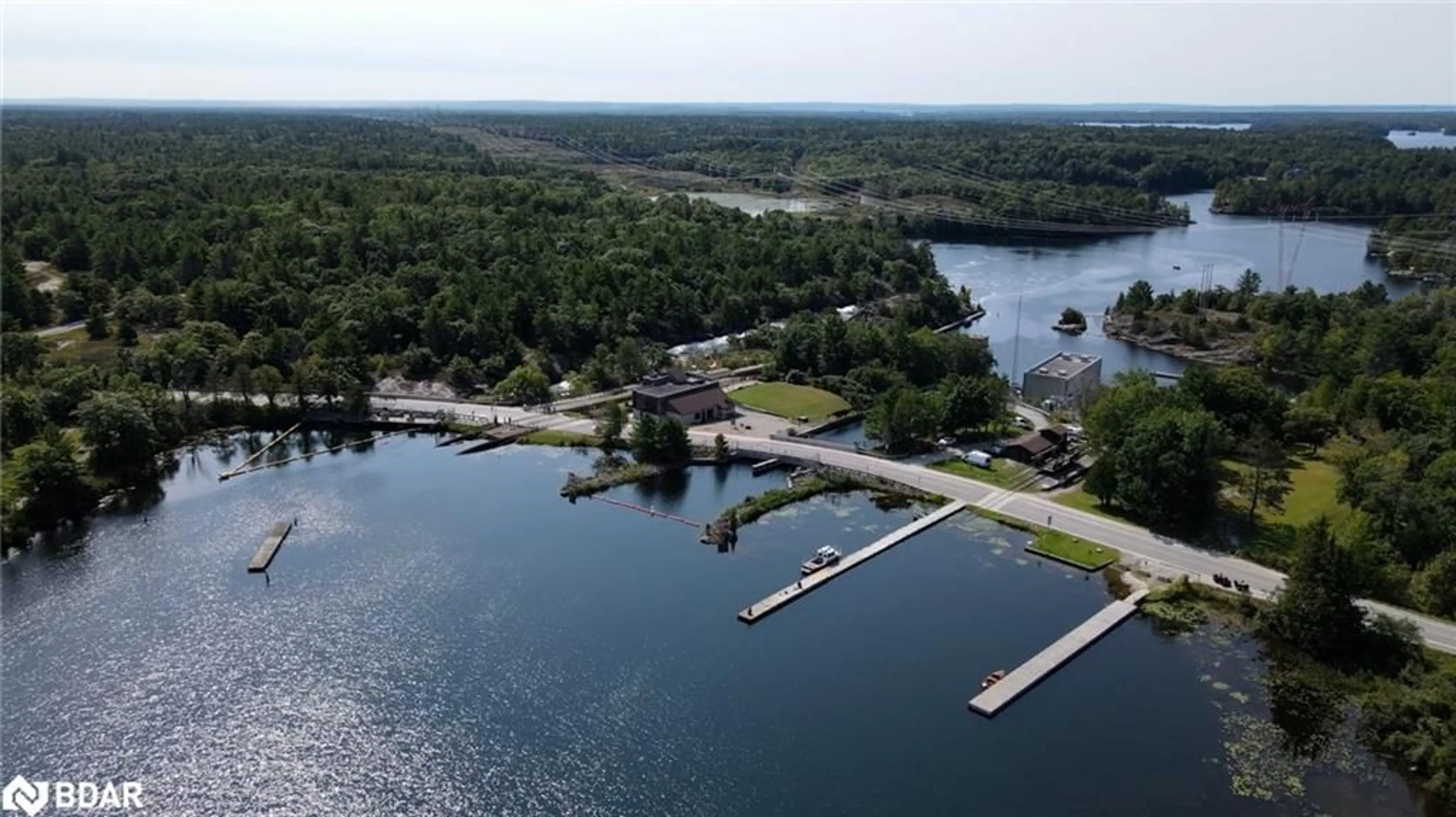 A pic from outside/outdoor area/front of a property/back of a property/a pic from drone, water/lake/river/ocean view for 4372 Conners Bay Lane, Coldwater Ontario L0K 1E0