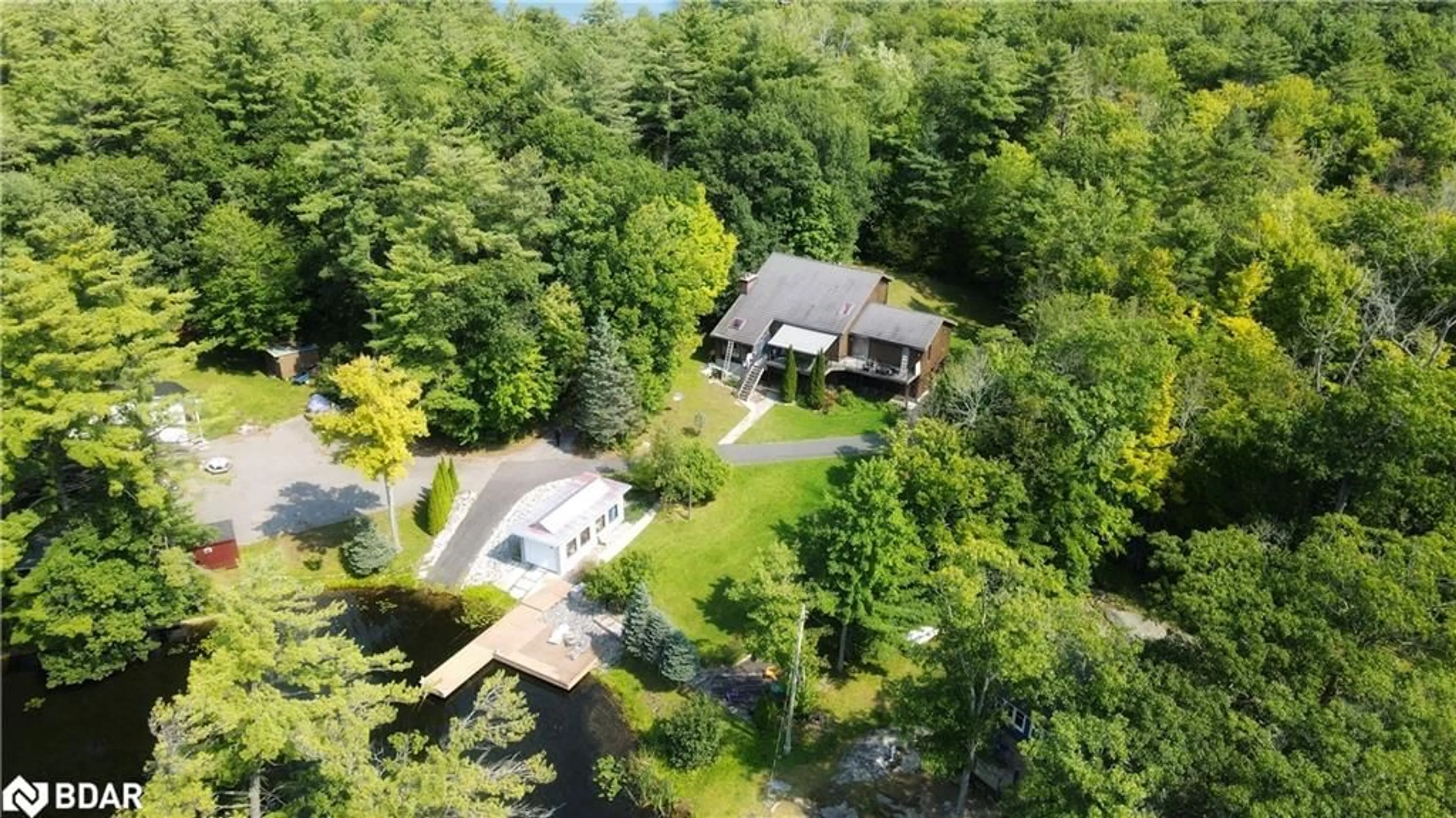 A pic from outside/outdoor area/front of a property/back of a property/a pic from drone, water/lake/river/ocean view for 4372 Conners Bay Lane, Coldwater Ontario L0K 1E0