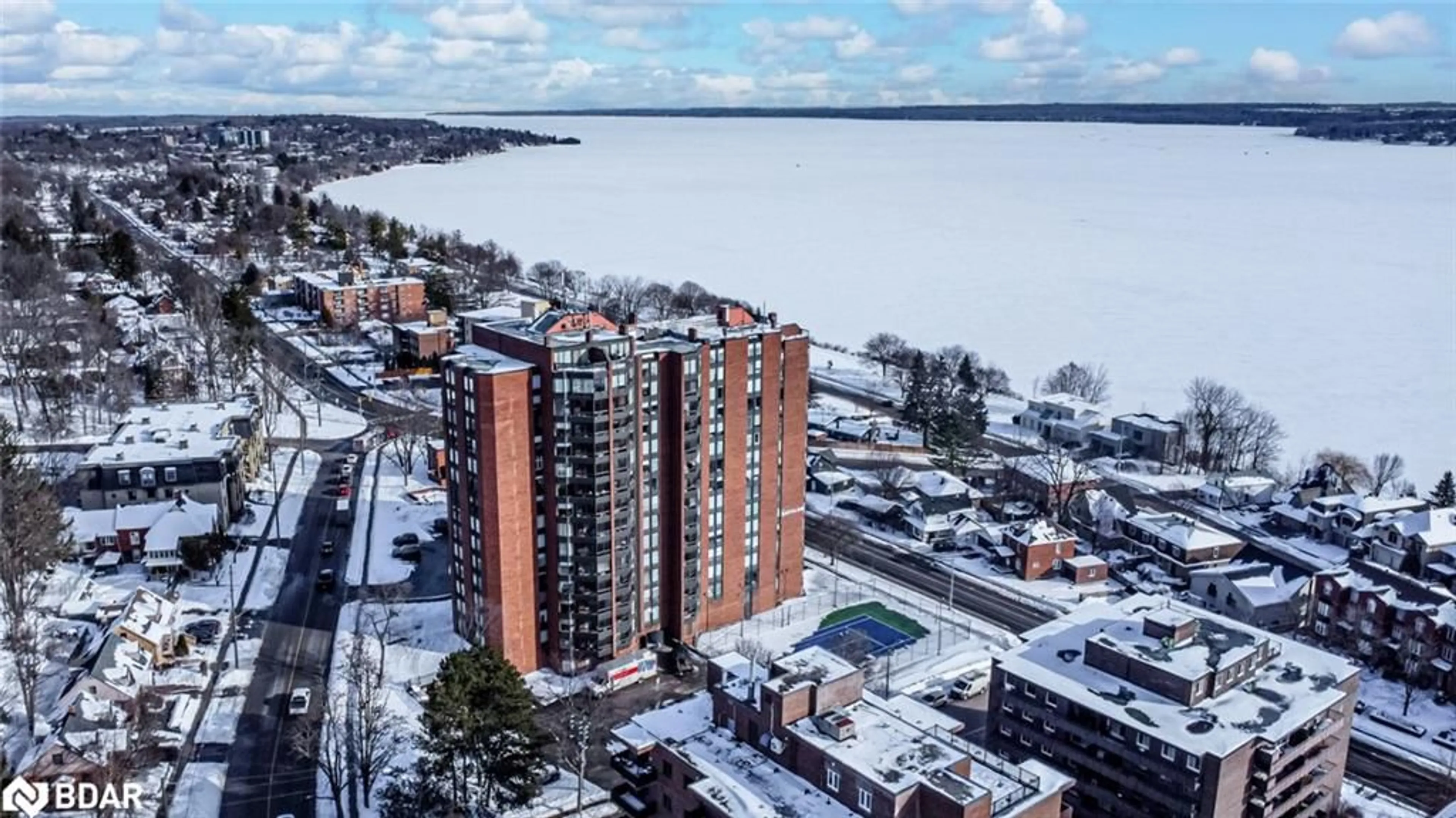 A pic from outside/outdoor area/front of a property/back of a property/a pic from drone, water/lake/river/ocean view for 181 Collier St #206, Barrie Ontario L4M 5L6