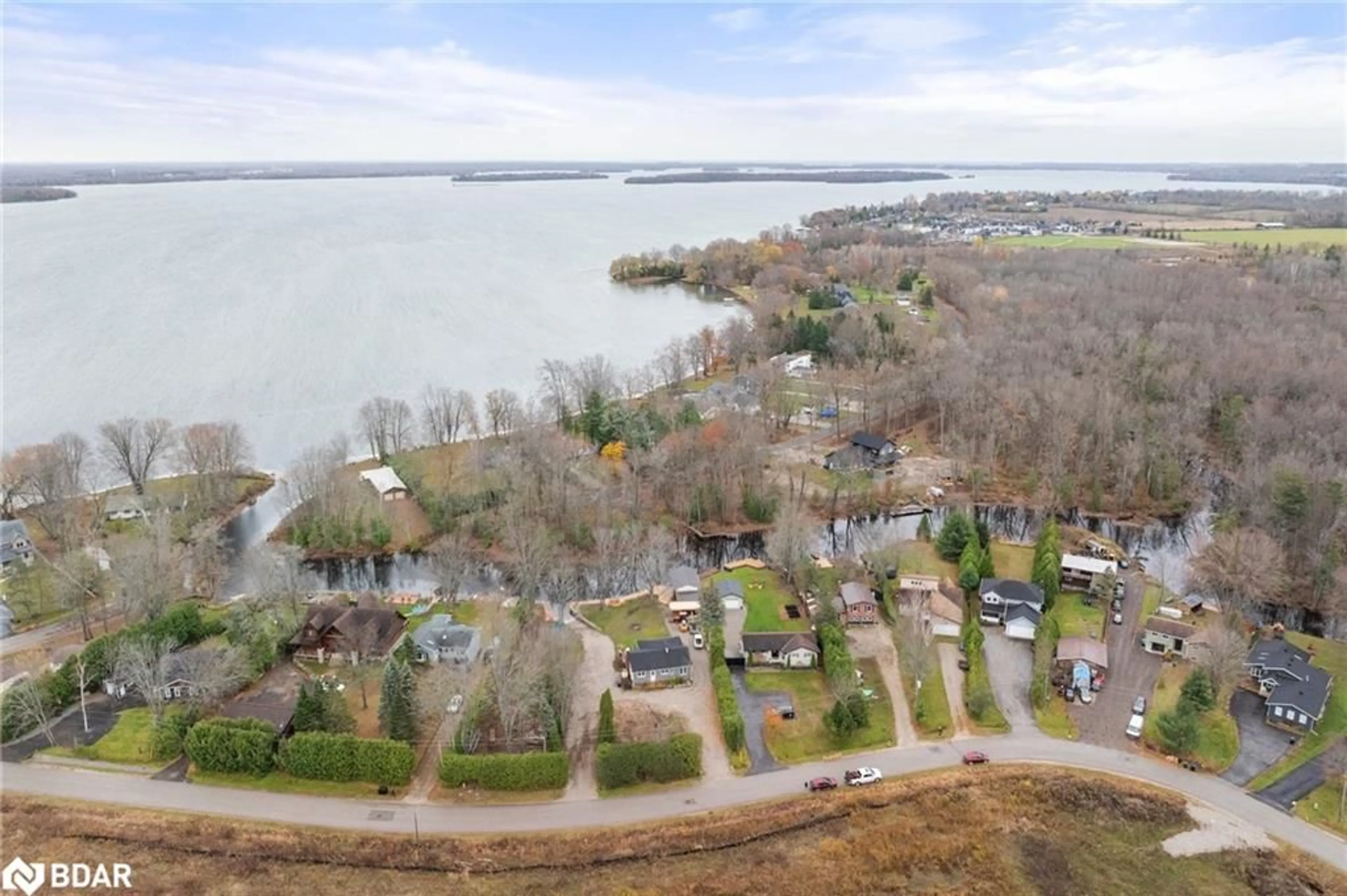 A pic from outside/outdoor area/front of a property/back of a property/a pic from drone, water/lake/river/ocean view for 2668 Westshore Crescent Cres, West Shore Ontario L3V 0V8